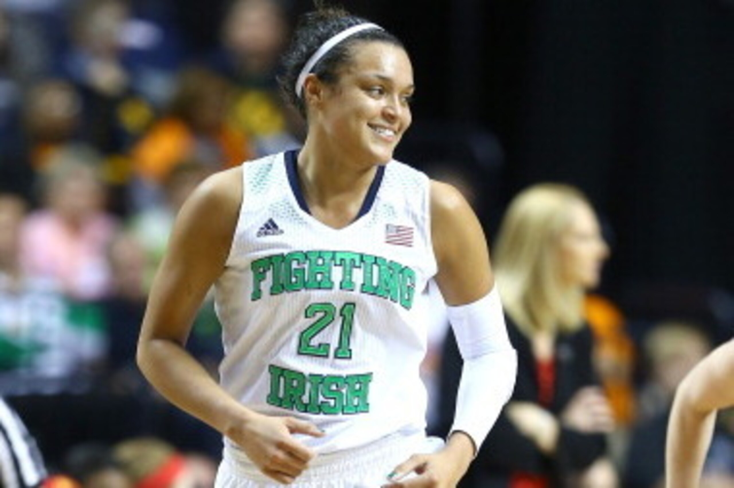 NASHVILLE, TN - APRIL 06: Kayla McBride #21 of the Notre Dame Fighting Irish smiles after a play in the first half against the Maryland Terrapins during the NCAA Women's Final Four semifinal at Bridgestone Arena on April 6, 2014 in Nashville, Tennessee. NASHVILLE, TN - APRIL 06: Kayla McBride #21 of the Notre Dame Fighting Irish smiles after a play in the first half against the Maryland Terrapins during the NCAA Women's Final Four semifinal at Bridgestone Arena on April 6, 2014 in Nashville, Tennessee.