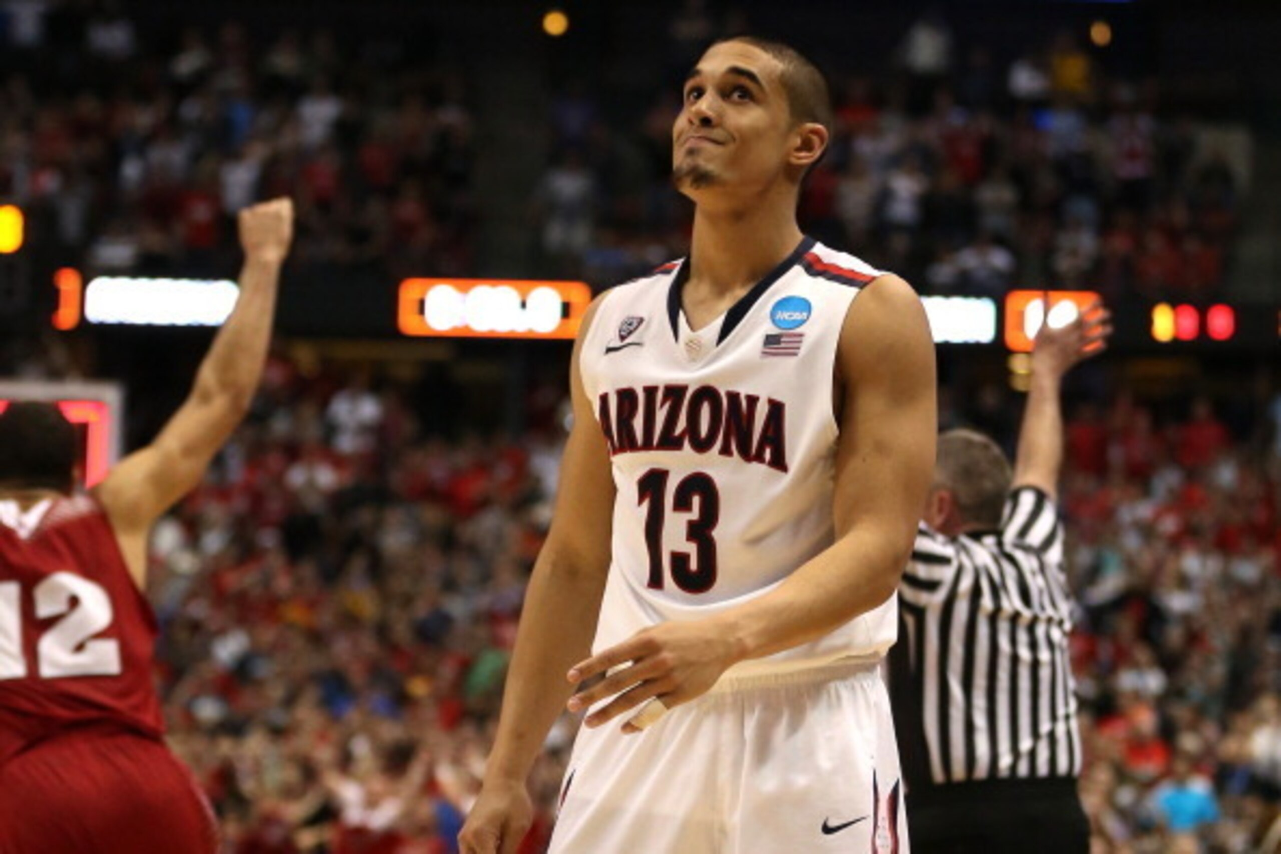 ANAHEIM, CA - MARCH 29: Nick Johnson #13 of the Arizona Wildcats reacts after missing a last-second shot in overtime before losing to the Wisconsin Badgers 64-63 during the West Regional Final of the 2014 NCAA Men's Basketball Tournament at the Honda Cen ANAHEIM, CA - MARCH 29: Nick Johnson #13 of the Arizona Wildcats reacts after missing a last-second shot in overtime before losing to the Wisconsin Badgers 64-63 during the West Regional Final of the 2014 NCAA Men's Basketball Tournament at the Honda Cen