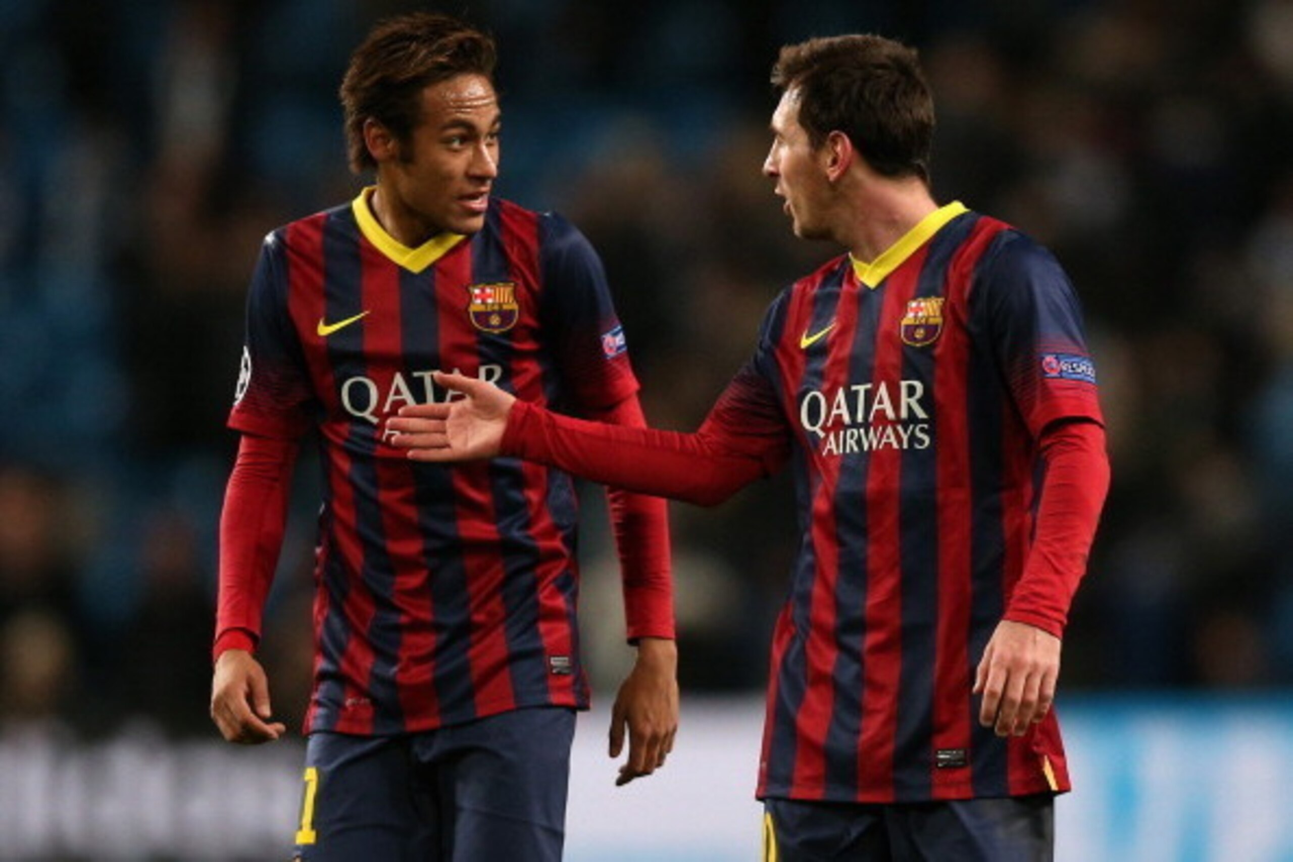 MANCHESTER, ENGLAND - FEBRUARY 18:  Neymar (L) and Lionel Messi of Barcelona walk off in good spirits following their team's victory at the end of the UEFA Champions League Round of 16 first leg match between Manchester City and Barcelona at the Etihad St