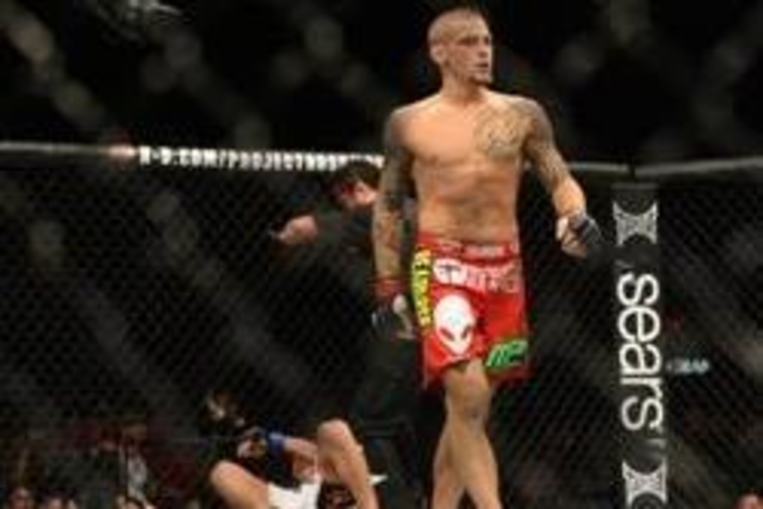 Dec 28, 2013; Las Vegas, NV, USA;    Dustin Poirier (red gloves) walks away from Diego Brandao (blue gloves) after winning his UFC Middleweight Bout at the MGM Grand Garden Arena. Mandatory Credit: Jayne Kamin-Oncea-USA TODAY Sports