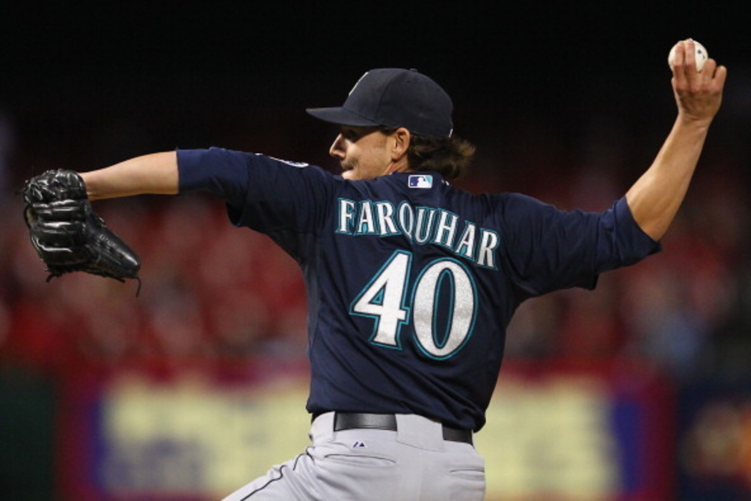 ST. LOUIS, MO - SEPTEMBER 14: Reliever Danny Farquhar #40 of the Seattle Mariners pitches against the St. Louis Cardinals in the ninth inning at Busch Stadium on September 14, 2013 in St. Louis, Missouri.  The Mariners beat the Cardinals 4-1.(Photo by Dil