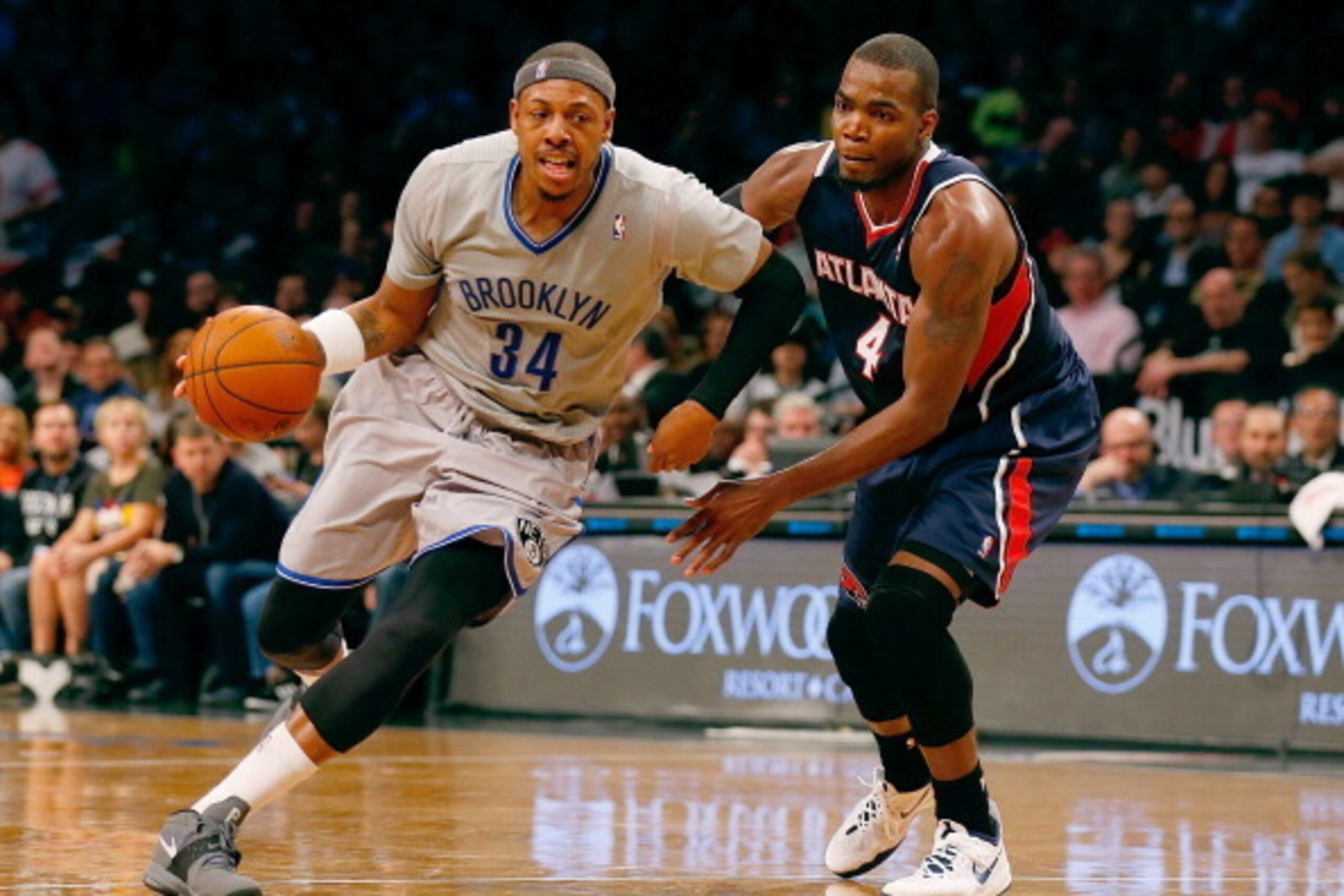 NEW YORK, NY - APRIL 11:  Paul Pierce #34 of the Brooklyn Nets drives towards the net against Paul Millsap #4 of the Atlanta Hawks at Barclays Center on April 11, 2014 in New York City. NOTE TO USER: User expressly acknowledges and agrees that, by downloa
