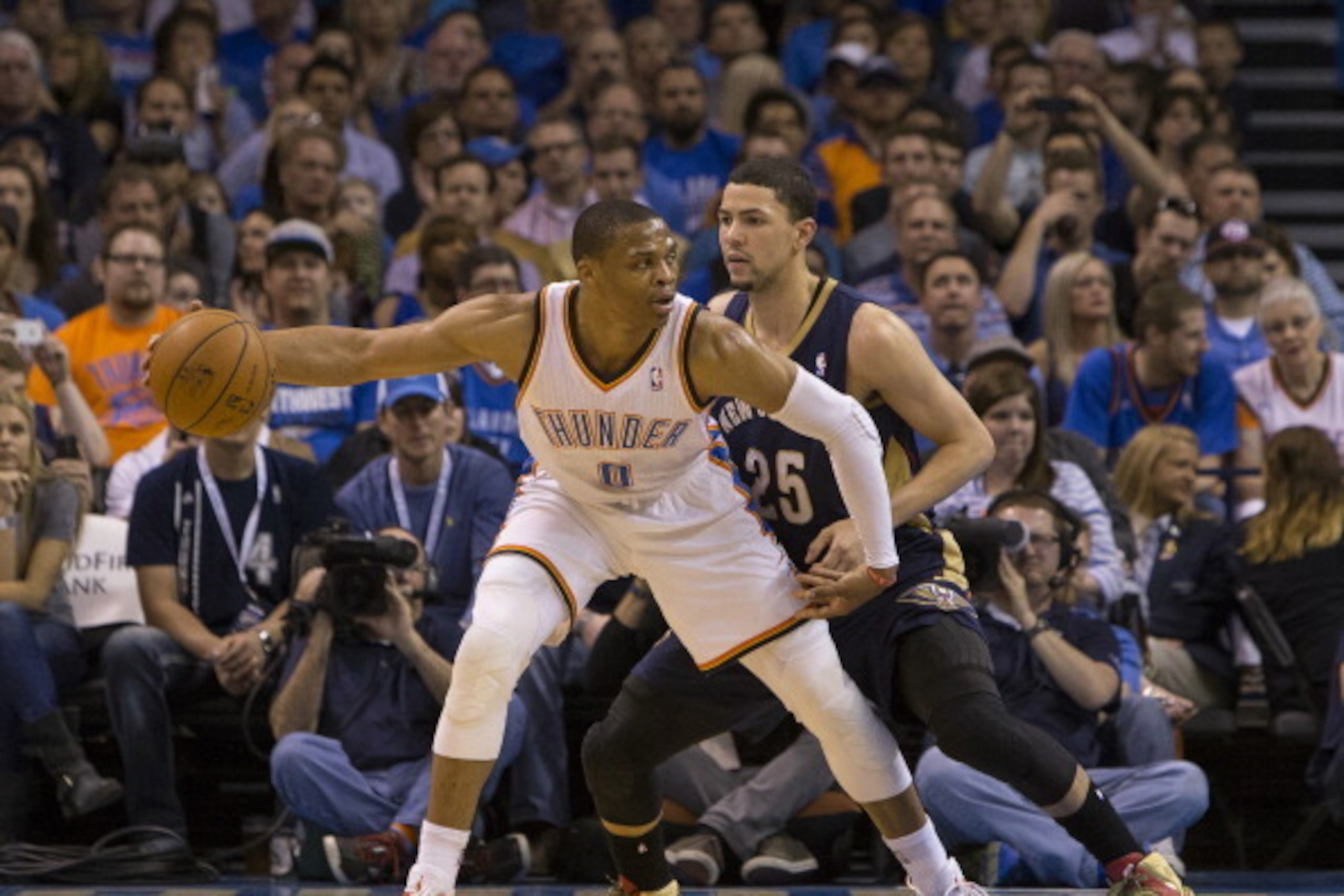 OKLAHOMA CITY, OK - April 11, 2014 : Russell Westbrook #0 of the Oklahoma City Thunder handles the ball against the New Orleans Pelicans at the Chesapeake Arena on April 11, 2014 in Oklahoma City, Oklahoma. NOTE TO USER:  User expressly acknowledges and a