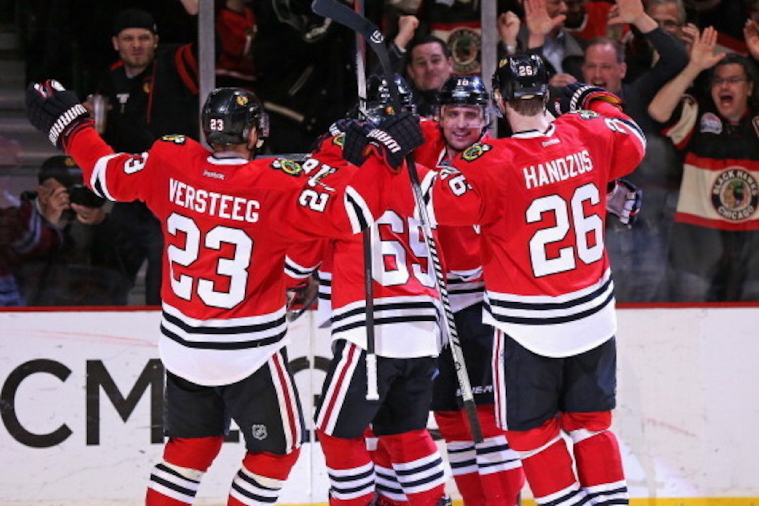 CHICAGO, IL - APRIL 09:  (L-R) Kris Versteeg #23, Andrew Shaw #65, Marian Hossa #81, Patrick Sharp #10 and Michal Handzus #26 of the Chicago Blackhawks celebrate Hossa's game-tying goal in the third period against the Montreal Canadiens at the United Cent