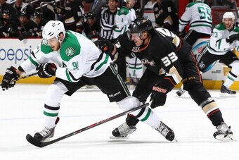 ANAHEIM, CA - FEBRUARY 1:  Tyler Seguin #91 of the Dallas Stars skates against Jakob Silfverberg #33 of the Anaheim Ducks at Honda Center on February 1, 2014 in Anaheim, California. (Photo by Debora Robinson/NHLI via Getty Images)