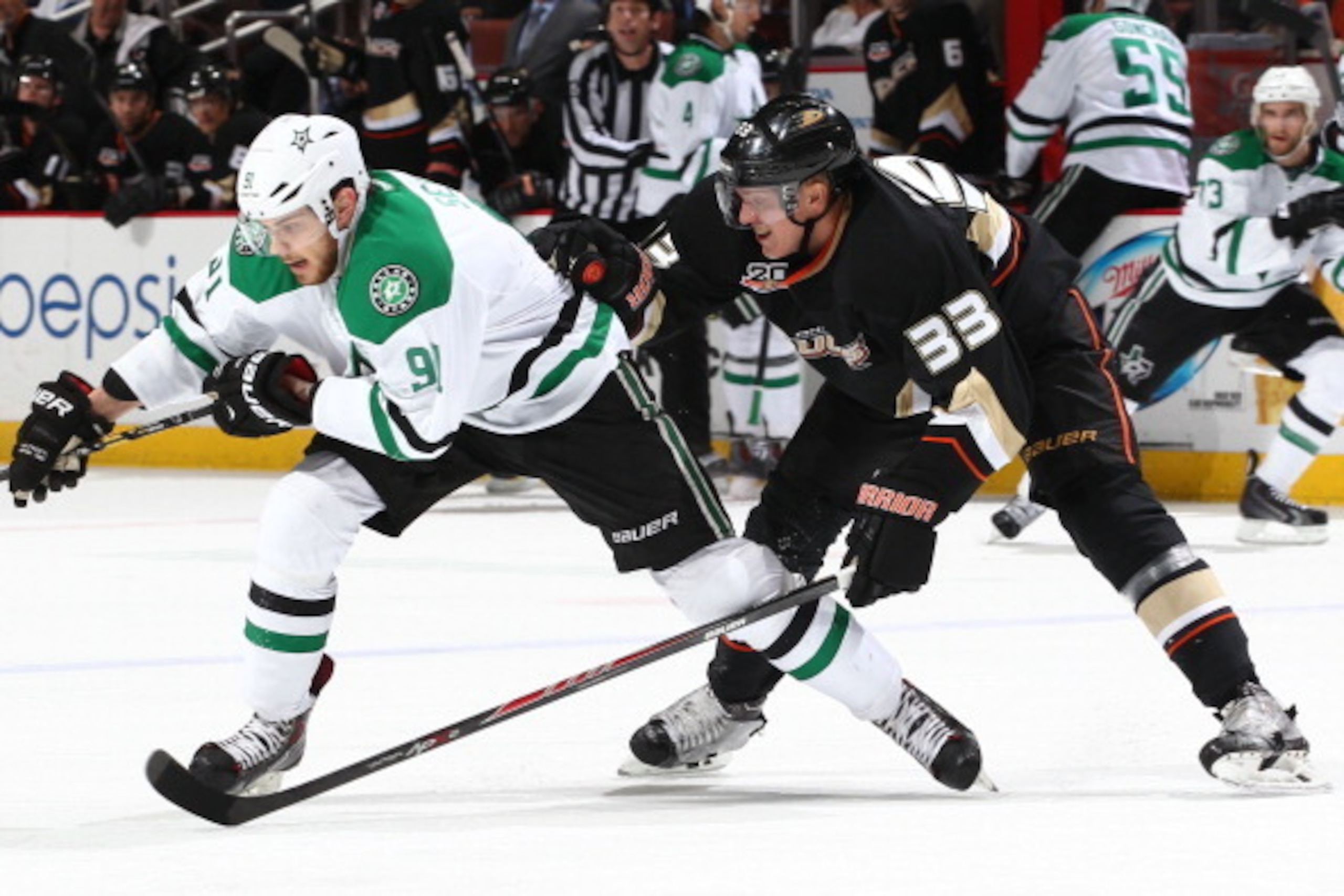 ANAHEIM, CA - FEBRUARY 1:  Tyler Seguin #91 of the Dallas Stars skates against Jakob Silfverberg #33 of the Anaheim Ducks at Honda Center on February 1, 2014 in Anaheim, California. (Photo by Debora Robinson/NHLI via Getty Images)