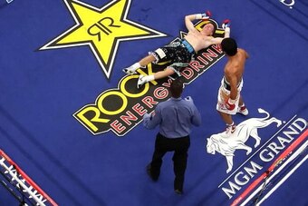 LAS VEGAS - MAY 02:  Manny Pacquiao of the Philippines stands over Ricky Hatton of England after knocking him out in the second round during their junior welterweight title fight at the MGM Grand Garden Arena May 2, 2009 in Las Vegas, Nevada.  (Photo by A