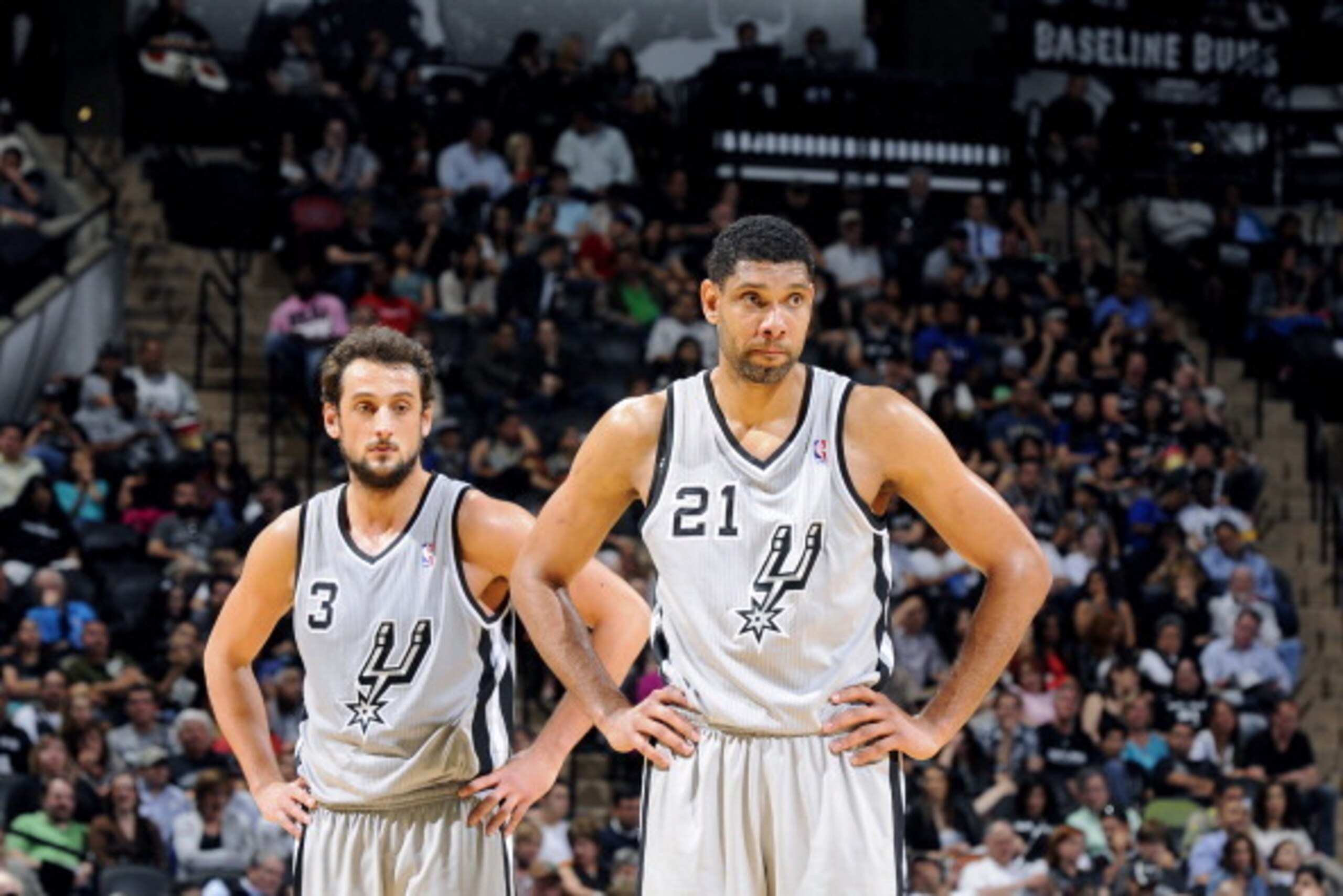 SAN ANTONIO, TX - March 29: Marco Belinelli #3 and Tim Duncan #21 of the San Antonio Spurs stand on the court during a game against the New Orleans Pelicans at the AT&T Center on March 29, 2014 in San Antonio, Texas. NOTE TO USER: User expressly acknowled