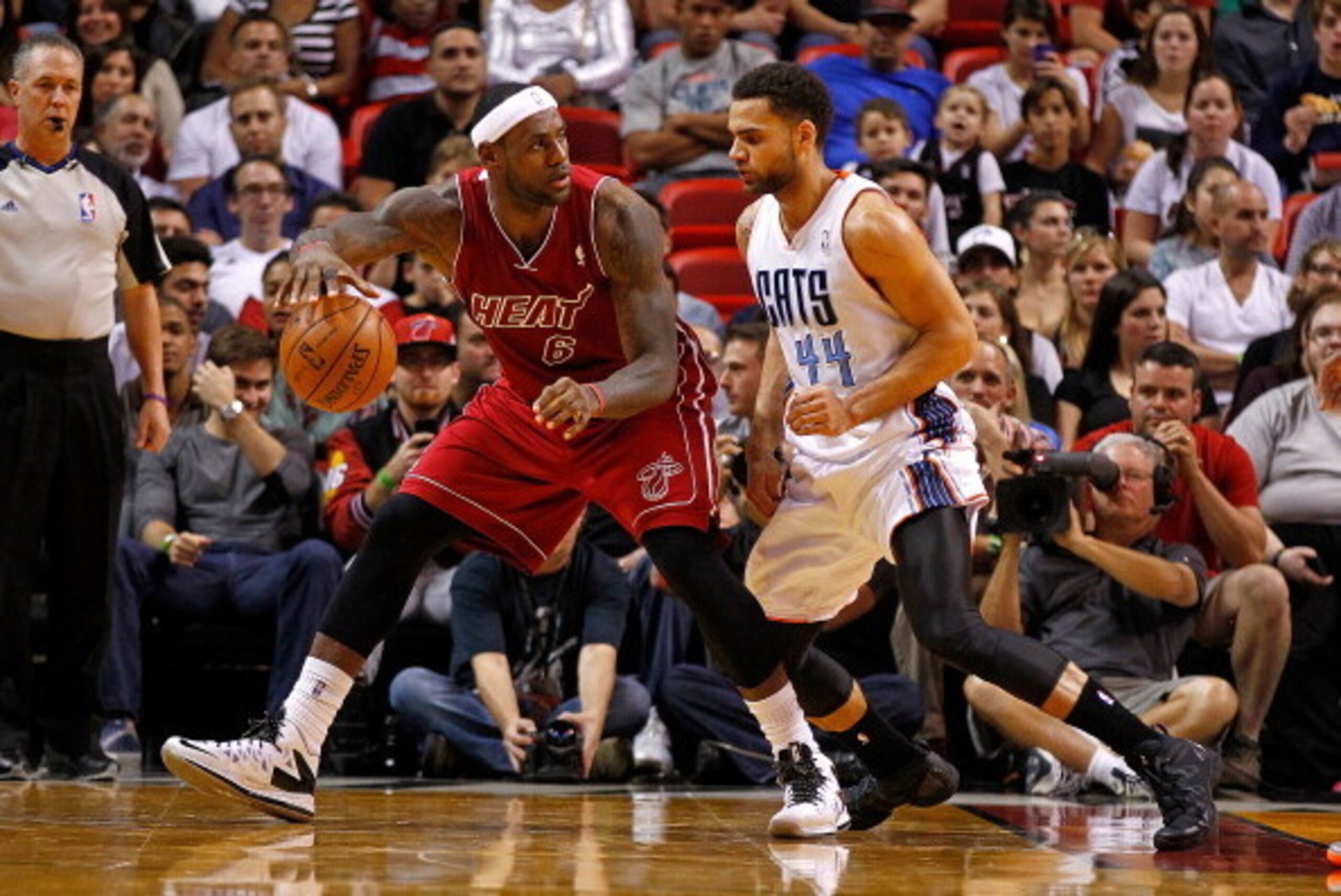 MIAMI, FL - DECEMBER 01:  LeBron James #6 of the Miami Heat posts up Jeff Taylor #44 of the Charlotte Bobcats during a game  at American Airlines Arena on December 1, 2013 in Miami, Florida. NOTE TO USER: User expressly acknowledges and agrees that, by do