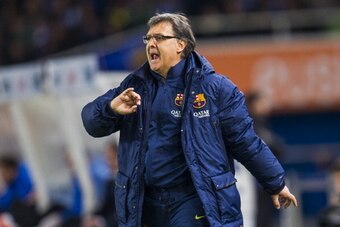 SAN SEBASTIAN, SPAIN - FEBRUARY 12:  Head coach Gerardo Tata Martino of FC Barcelona reacts during the Copa del Rey Semi-Final first leg match betweenReal Sociedad and Barcelona at Estadio Anoeta  on February 12, 2014 in San Sebastian, Spain.  (Photo by J