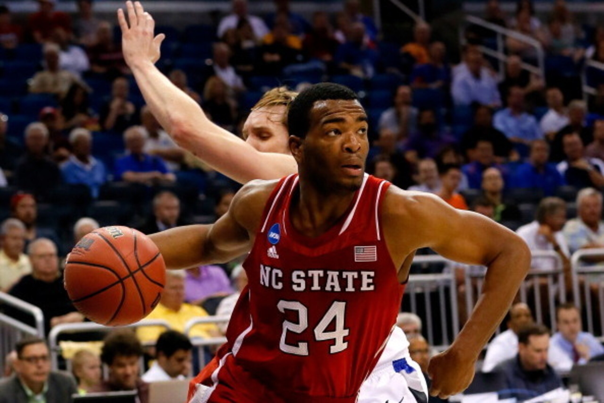 ORLANDO, FL - MARCH 20: T.J. Warren #24 of the North Carolina State Wolfpack drives to the basket against Jake Barnett #30 of the Saint Louis Billikens during the second round of the 2014 NCAA Men's Basketball Tournament at Amway Center on March 20, 2014 ORLANDO, FL - MARCH 20: T.J. Warren #24 of the North Carolina State Wolfpack drives to the basket against Jake Barnett #30 of the Saint Louis Billikens during the second round of the 2014 NCAA Men's Basketball Tournament at Amway Center on March 20, 2014