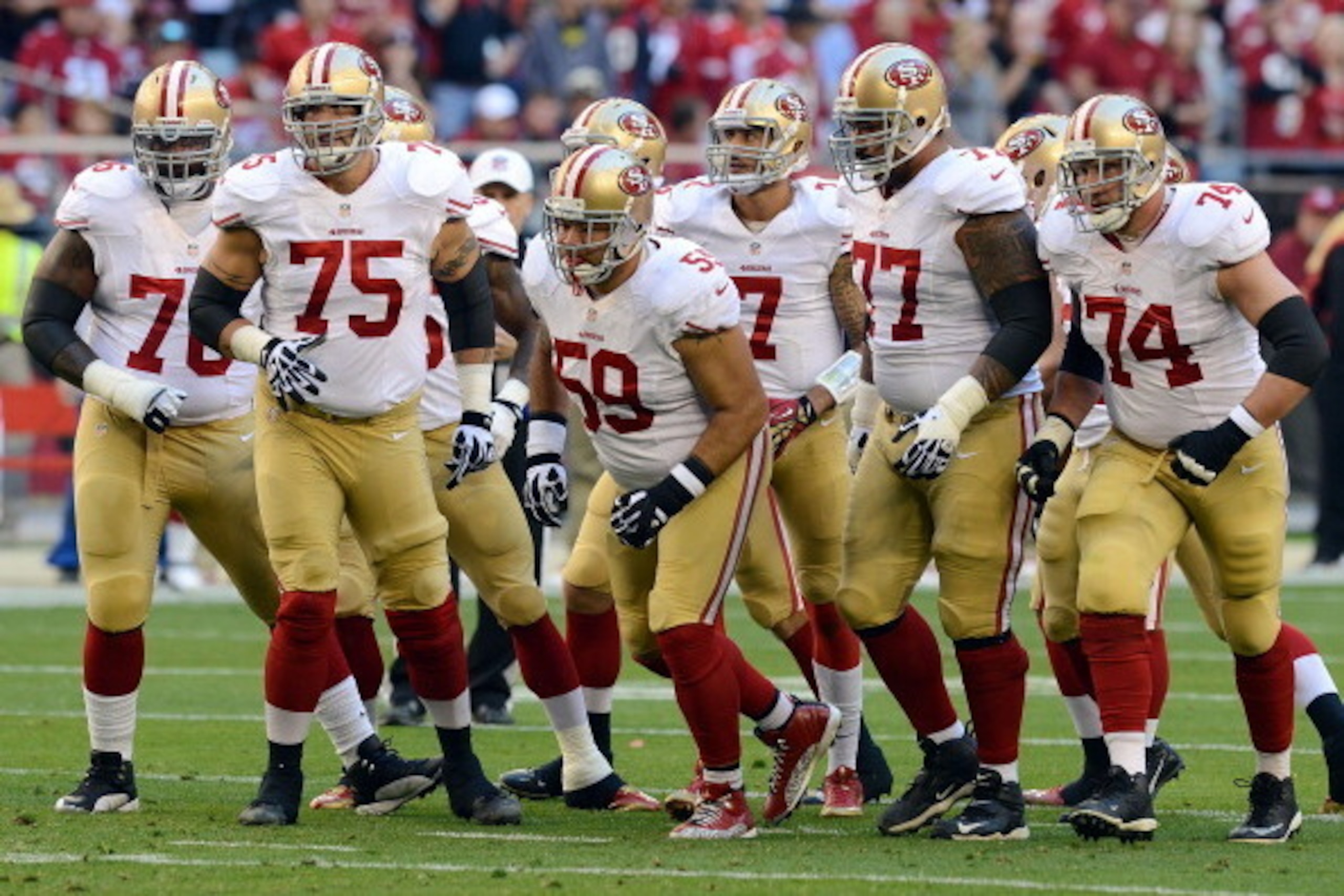 GLENDALE, AZ - DECEMBER 29:  Anthony Davis #76, Alex Boone #75, Jonathan Goodwin #59, Mike Iupati #77, Joe Staley #74 and Colin Kaepernick #7 of the San Francisco 49ers run up to the line of scrimmage against the Arizona Cardinals at University of Phoenix