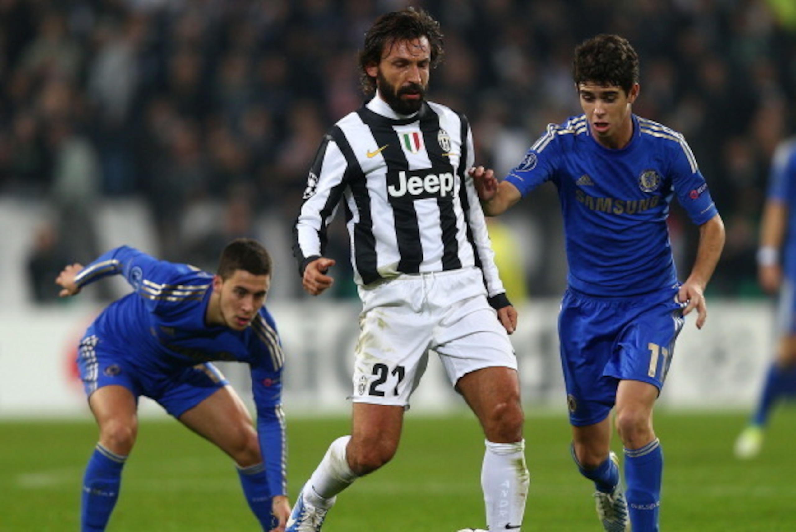 TURIN, ITALY - NOVEMBER 20:  Andrea Pirlo of Juventus holds the ball from Oscar and Eden Hazard of Chelsea during the UEFA Champions League Group E match between Juventus and Chelsea at the Juventus Arena on November 20, 2012 in Turin, Italy.  (Photo by C