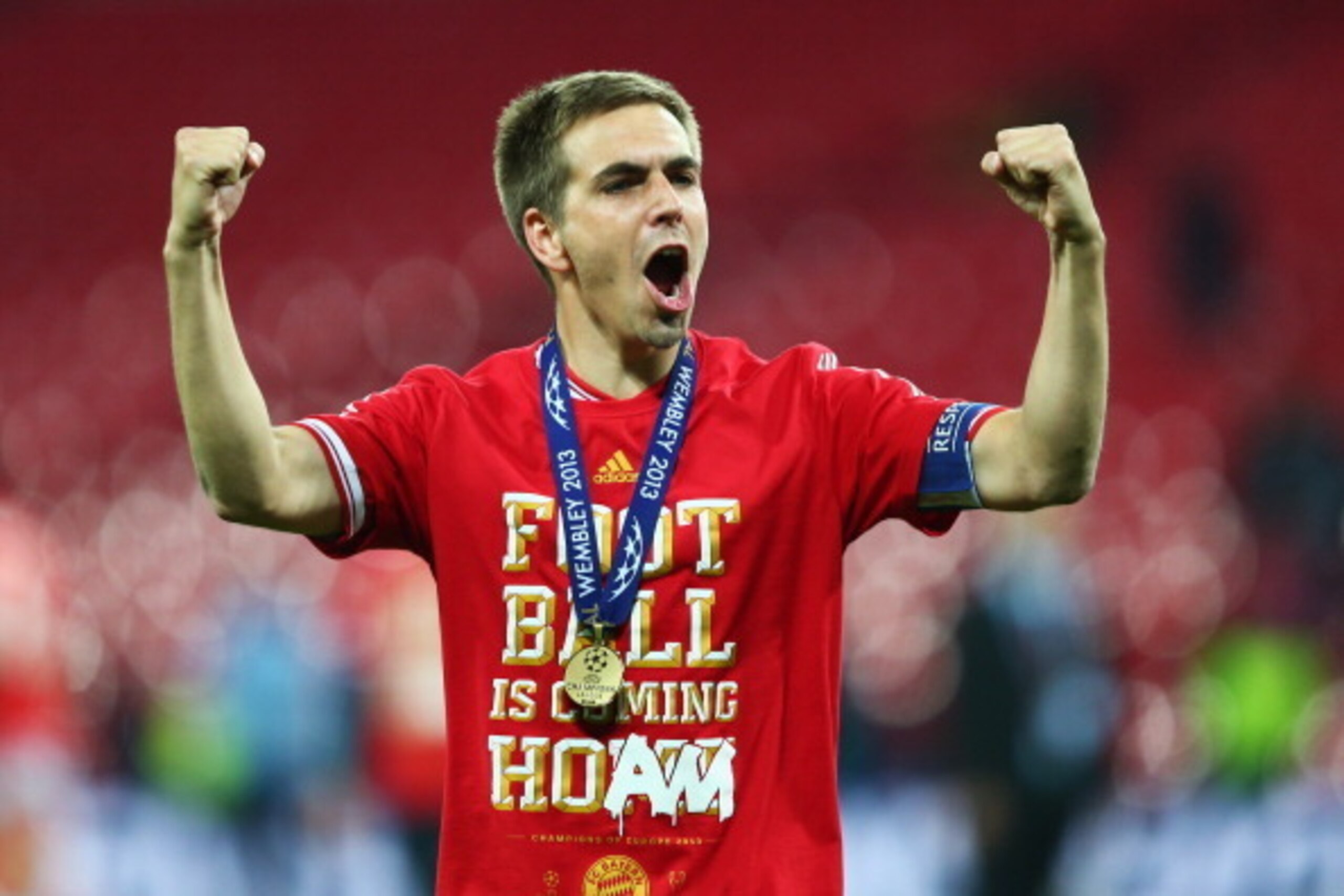 LONDON, ENGLAND - MAY 25:  Philipp Lahm of Bayern Muenchen celebrates victory after the UEFA Champions League final match between Borussia Dortmund and FC Bayern Muenchen at Wembley Stadium on May 25, 2013 in London, United Kingdom.  (Photo by Alex Grimm/