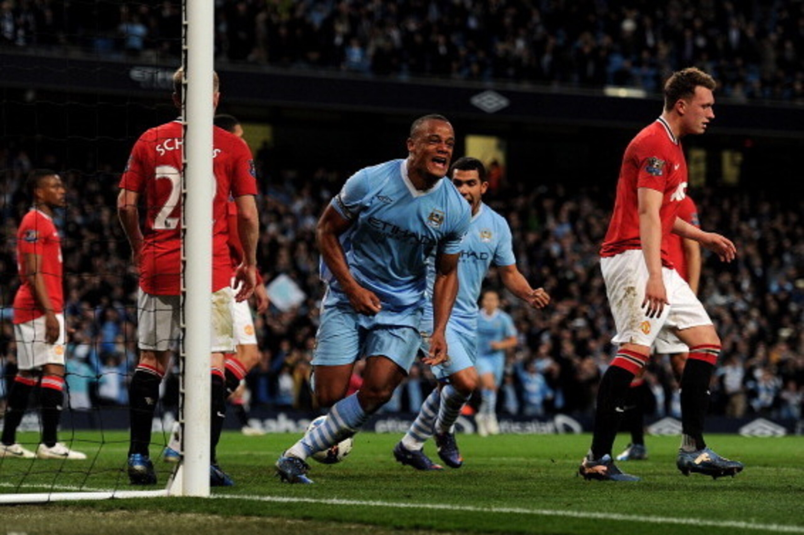 MANCHESTER, ENGLAND - APRIL 30:  Vincent Kompany of Manchester City celebrates scoring the opening goal during the Barclays Premier League match between Manchester City and Manchester United at the Etihad Stadium on April 30, 2012 in Manchester, England. 