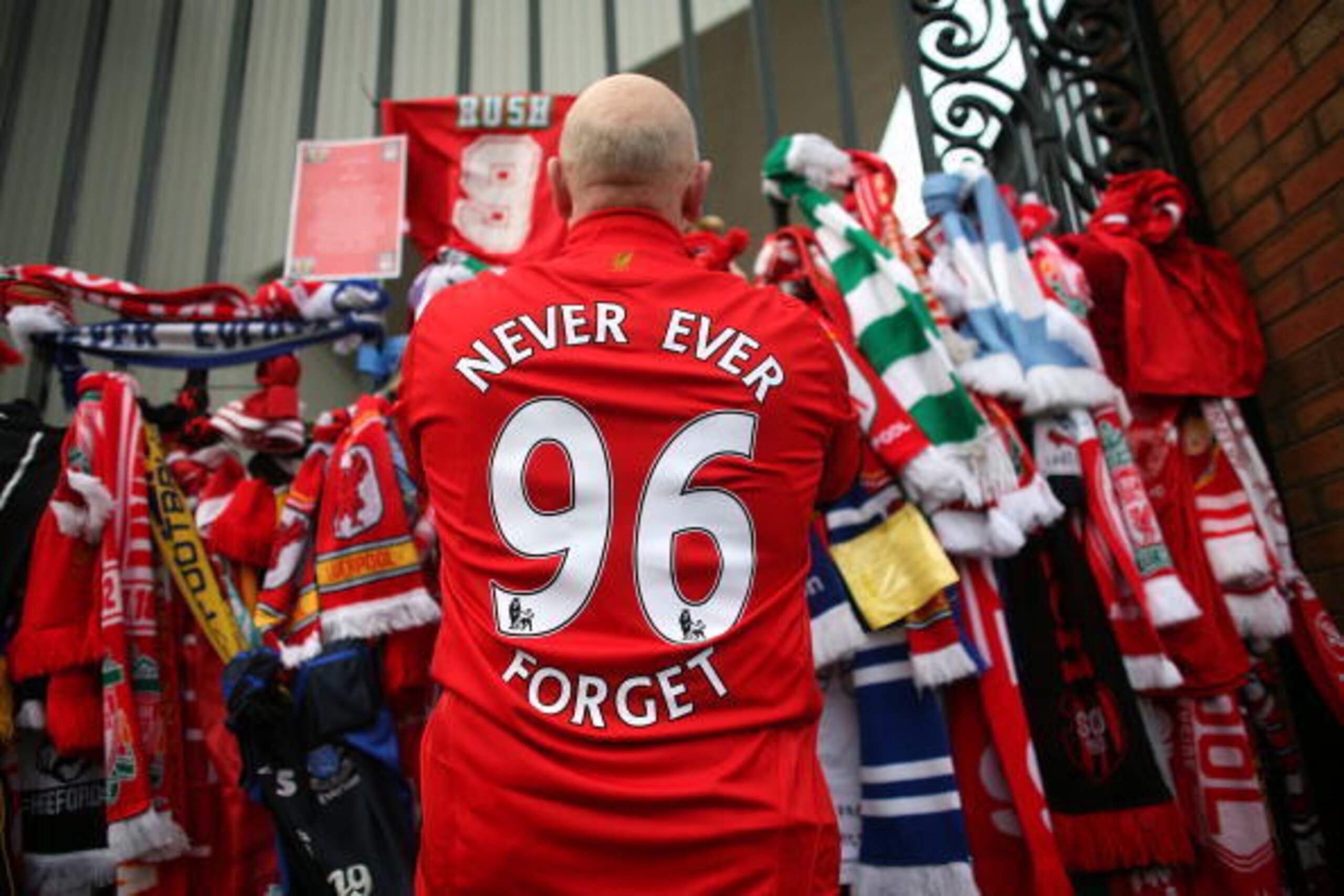LIVERPOOL, ENGLAND - APRIL 15:  Liverpool fans pay their respects at the Hillsborough memorial at Anfield on April 15, 2009, Liverpool, England.  Thousands of fans, friends and relatives are descending on Liverpool's Anfield Stadium to mark the 20th anniv