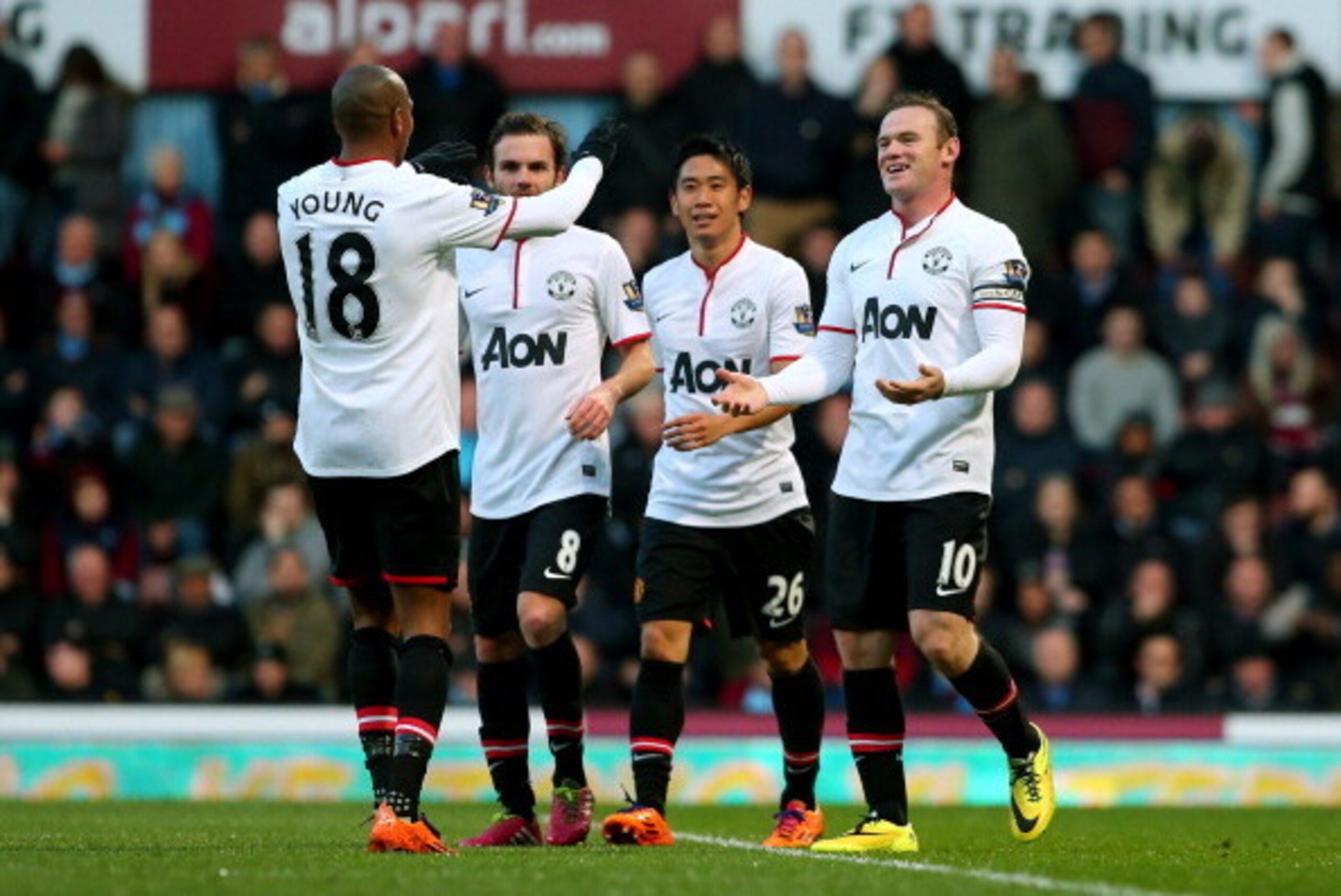 LONDON, ENGLAND - MARCH 22:  (R-L) Wayne Rooney of Manchester United is congratulated by teammates Shinji Kagawa, Juan Mata and Ashley Young after scoring his team's second goal during the Barclays Premier League match between West Ham United and Manchest