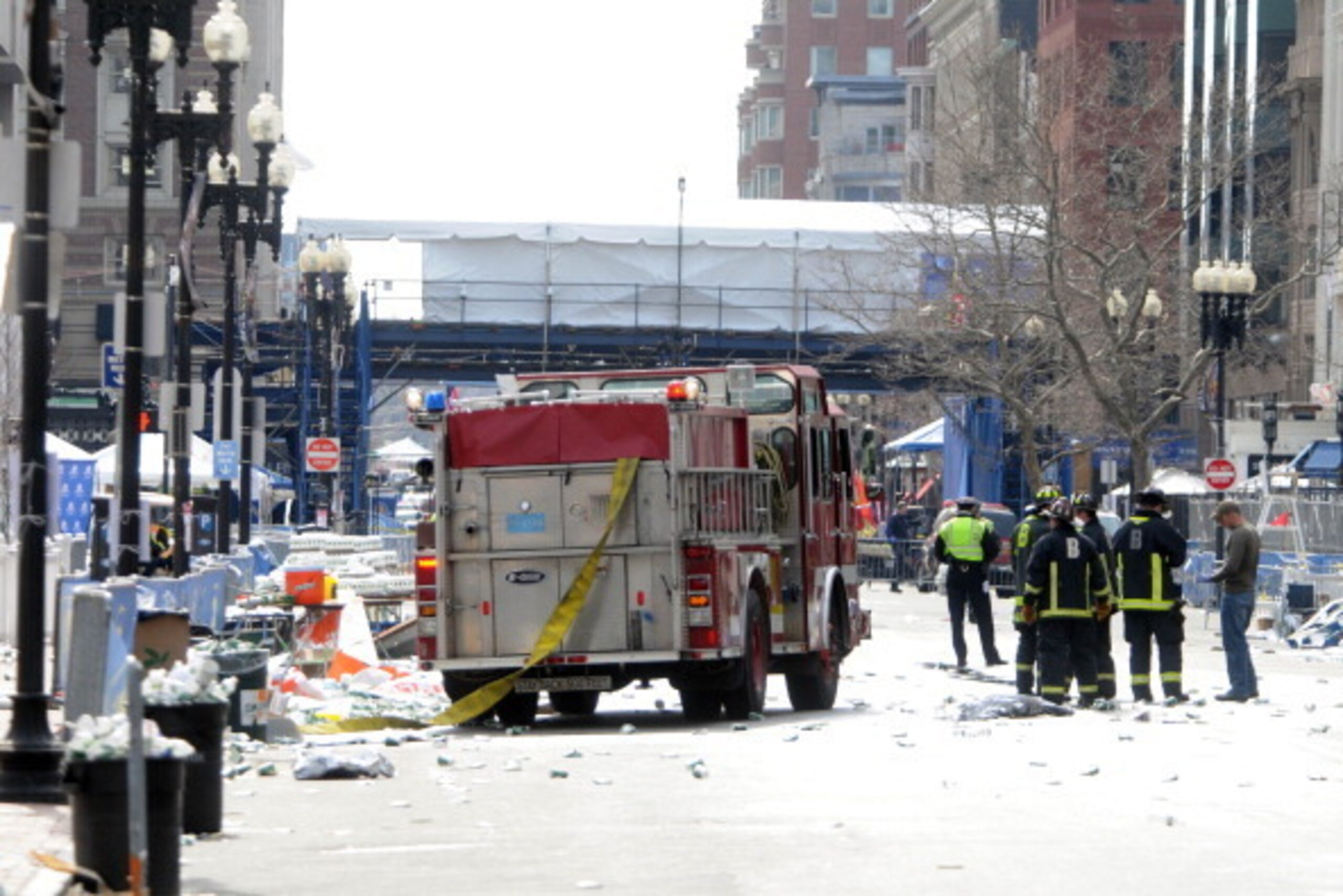 BOSTON, MA - APRIL 15:  Firefighters take postion on Boyltson Street near the finish line after two bombs exploded during the 117th Boston Marathon on April 15, 2013 in Boston, Massachusetts. Two people are confirmed dead and at least 28 injured after at 