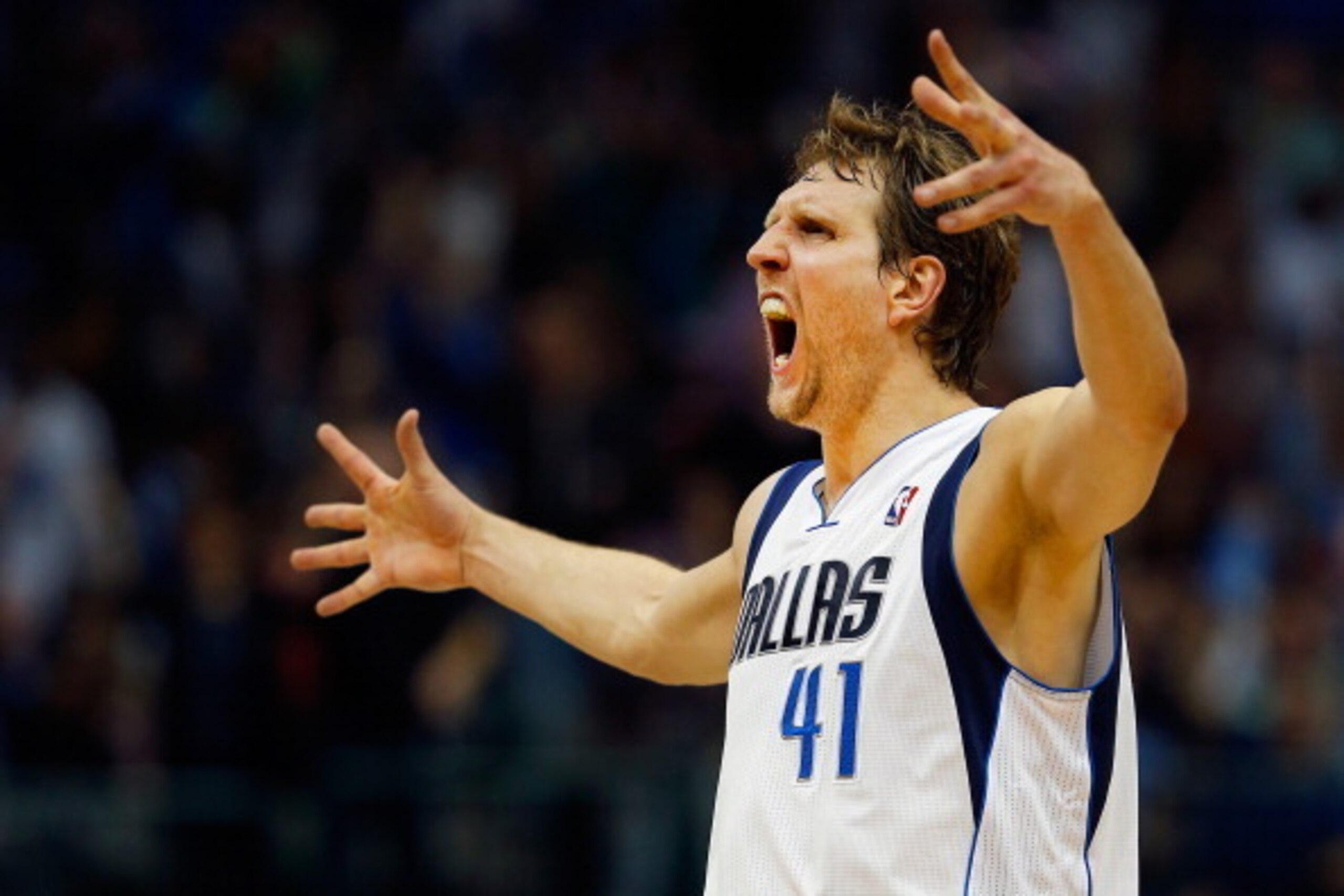 DALLAS, TX - APRIL 12:  Dirk Nowitzki #41 of the Dallas Mavericks reacts after making a three point shot against the Phoenix Suns in the third quarter at American Airlines Center on April 12, 2014 in Dallas, Texas.  (Photo by Tom Pennington/Getty Images)