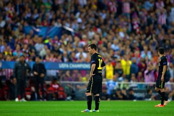 MADRID, SPAIN - APRIL 09:  A dejected Lionel Messi of Barcelona looks on during the UEFA Champions League Quarter Final second leg match between Club Atletico de Madrid and FC Barcelona at Vicente Calderon Stadium on April 9, 2014 in Madrid, Spain.  (Phot