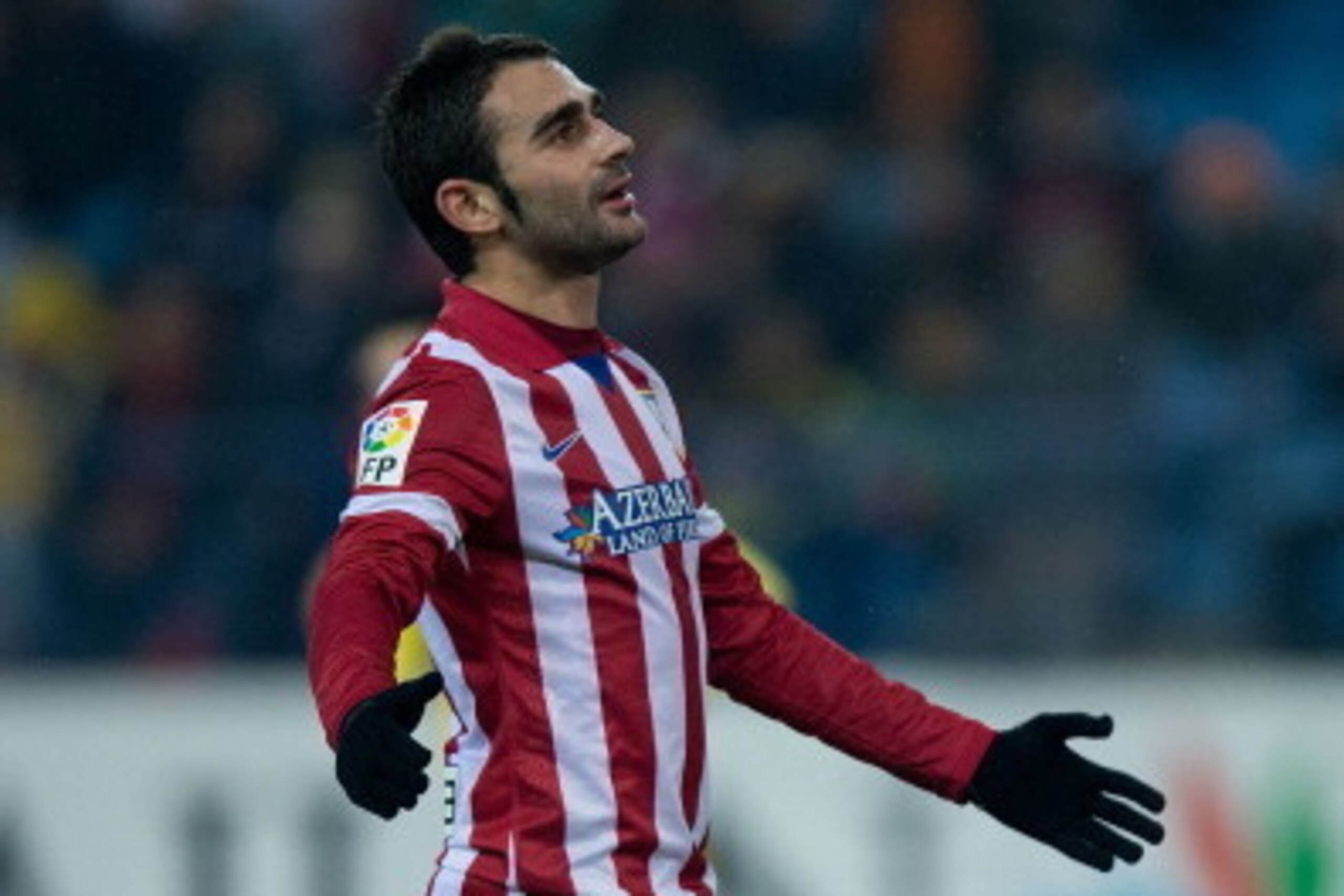 MADRID, SPAIN - DECEMBER 18:  Adrian Lopez of Atletico de Madrid reacts as he fails to score during the Copa del Rey Round of 32 second leg match between Club Atletico de Madrid and Sant Andreu at Vivente Calderon Stadium on December 18, 2013 in Madrid, S