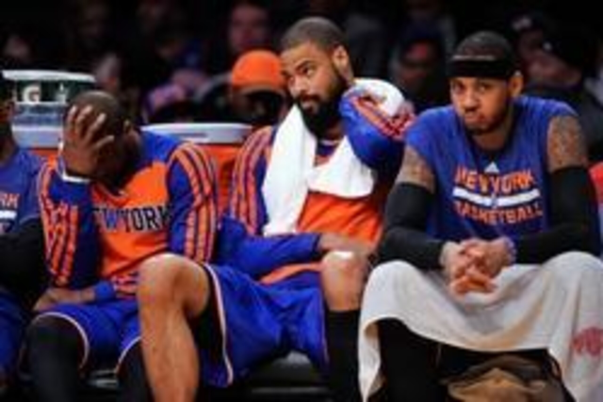 Mar 25, 2014; Los Angeles, CA, USA;  New York Knicks players Raymond Felton, Tyspon Chandler and Carmelo Anthony on the bench during the final five minutes of the Knicks loss to the Los Angeles Lakers at Staples Center. Mandatory Credit: Robert Hanashiro-