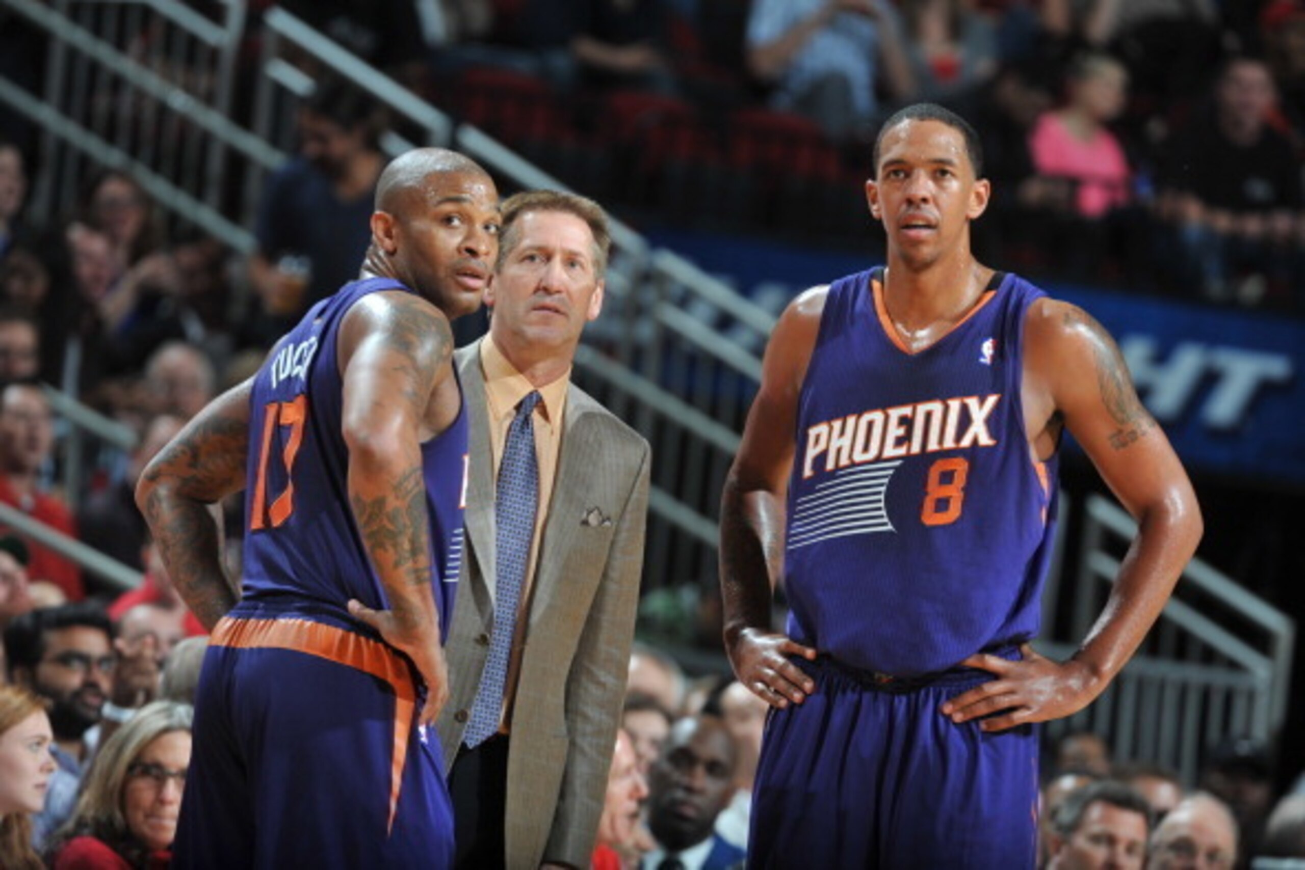 HOUSTON, TX - DECEMBER 4:  P.J. Tucker #17, Jeff Hornacek and Channing Frye #8 of the Phoenix Suns looks on during the game against the Houston Rockets on December 4, 2013 at the Toyota Center in Houston, Texas. NOTE TO USER: User expressly acknowledges a