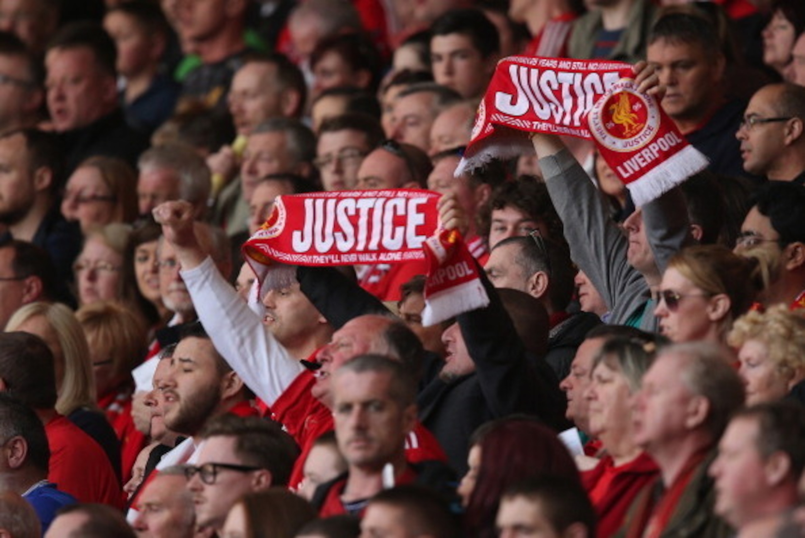 LIVERPOOL, ENGLAND - APRIL 15: Liverpool supporters attend the memorial service marking the 25th anniversary of the Hillsborough Disaster at Anfield stadium on April 15, 2014 in Liverpool, England. Thousands of fans, friends and relatives took part in th LIVERPOOL, ENGLAND - APRIL 15: Liverpool supporters attend the memorial service marking the 25th anniversary of the Hillsborough Disaster at Anfield stadium on April 15, 2014 in Liverpool, England. Thousands of fans, friends and relatives took part in th