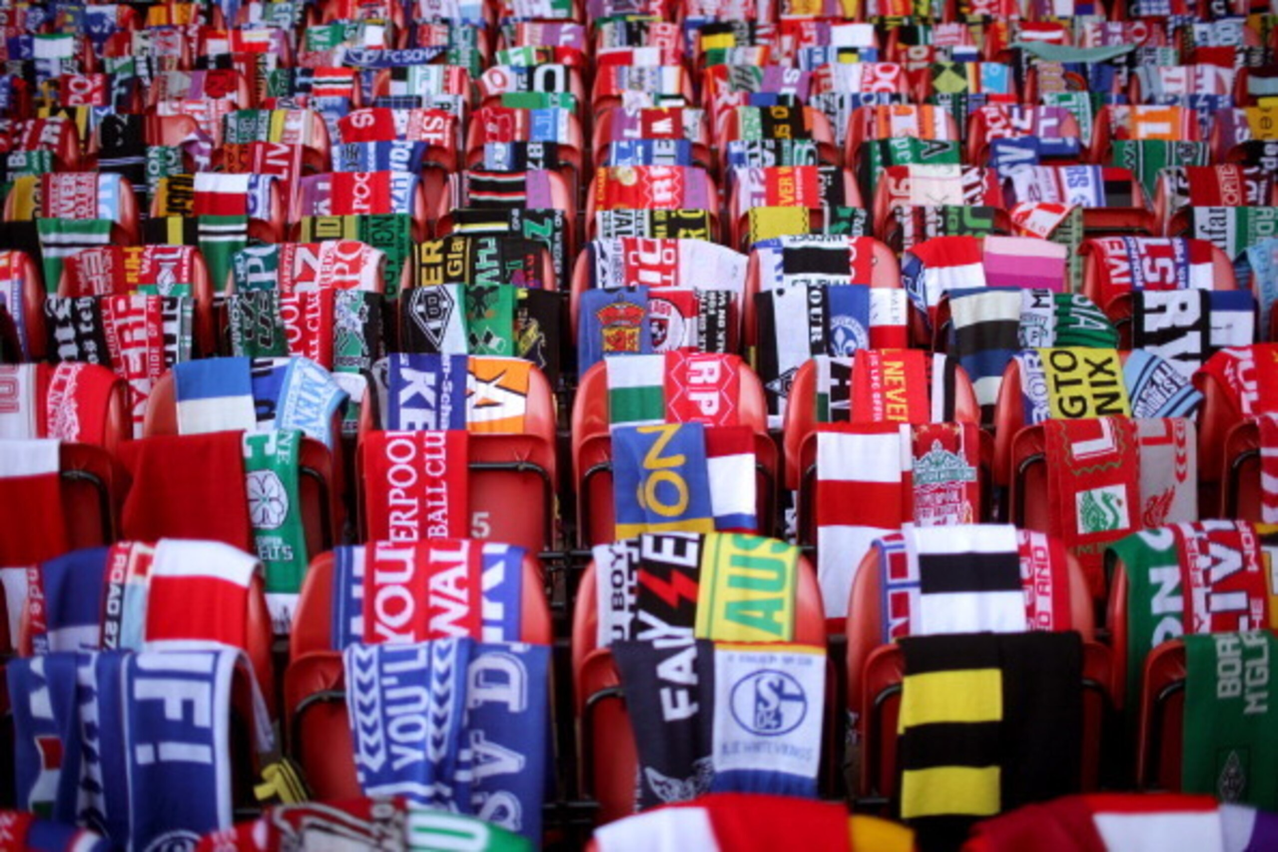 LIVERPOOL, ENGLAND - APRIL 15: Scarves donated by fans of Liverpool and teams across the world are placed on empty seats during the memorial service marking the 25th anniversary of the Hillsborough Disaster, at Anfield stadium on April 15, 2014 in Liverp LIVERPOOL, ENGLAND - APRIL 15: Scarves donated by fans of Liverpool and teams across the world are placed on empty seats during the memorial service marking the 25th anniversary of the Hillsborough Disaster, at Anfield stadium on April 15, 2014 in Liverp