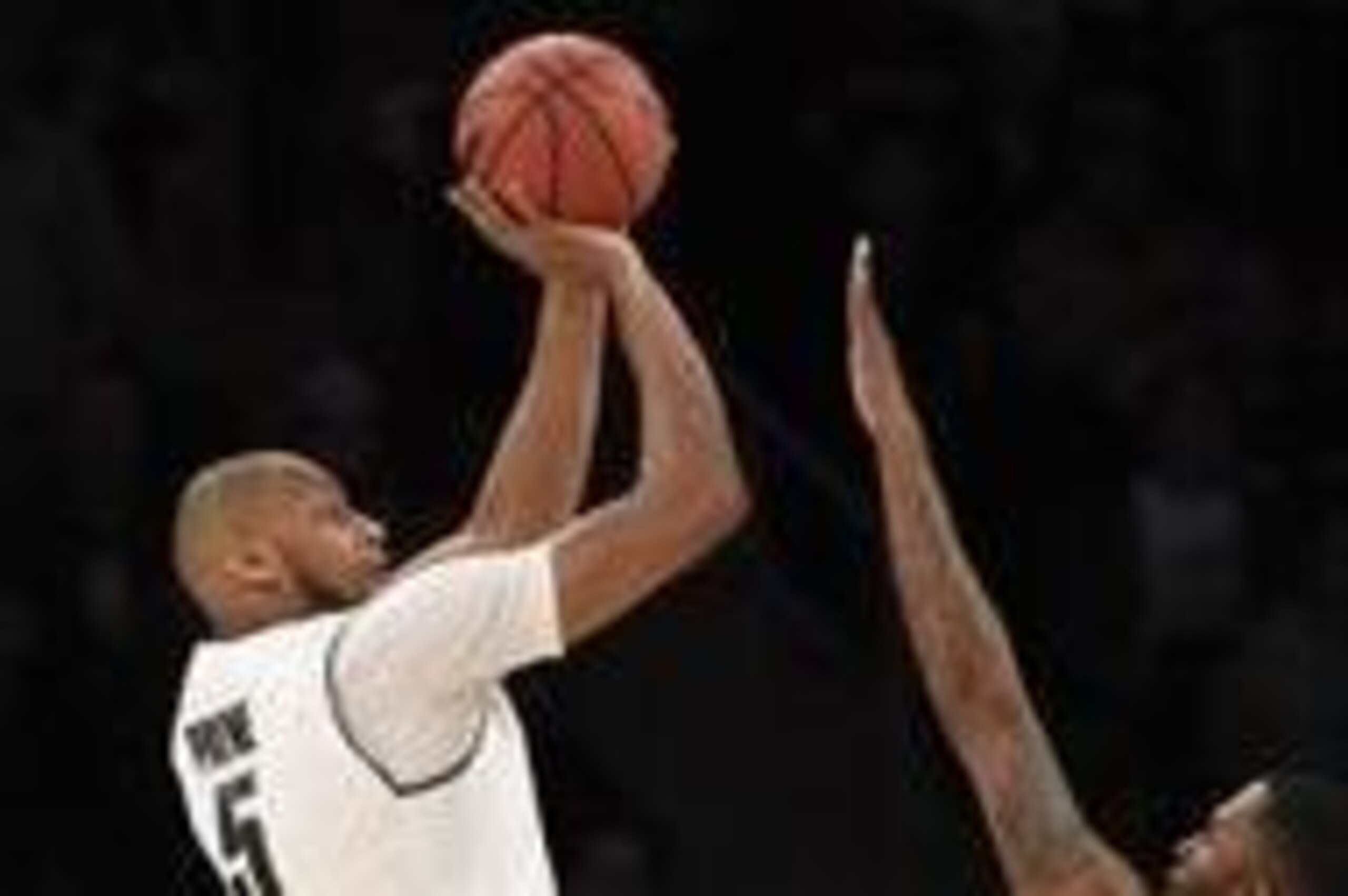 Mar 30, 2014; New York, NY, USA; Michigan State Spartans forward Adreian Payne (5) shoots the ball over Connecticut Huskies de Phillip Nolan (0) during the first hald in the finals of the east regional of the 2014 NCAA Mens Basketball Championship tournam