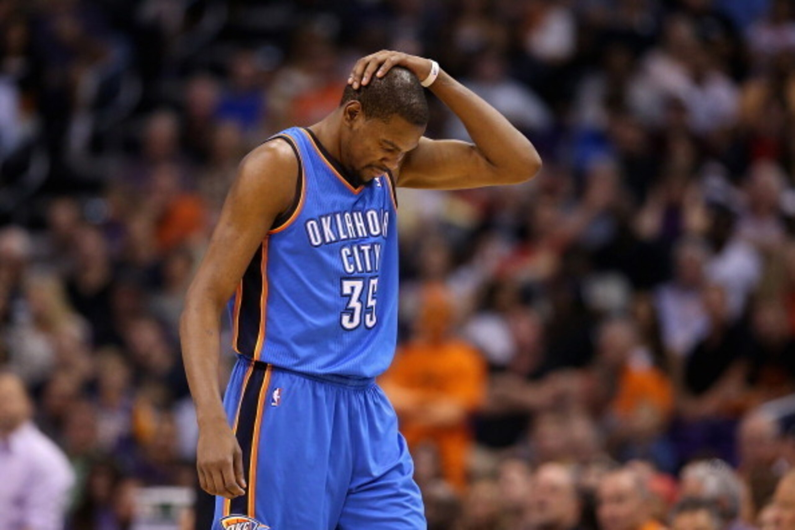 PHOENIX, AZ - APRIL 06:  Kevin Durant #35 of the Oklahoma City Thunder reacts as he walks down court during the second half of the NBA game against the Phoenix Suns at US Airways Center on April 6, 2014 in Phoenix, Arizona.  The Suns defeated the Thunder 