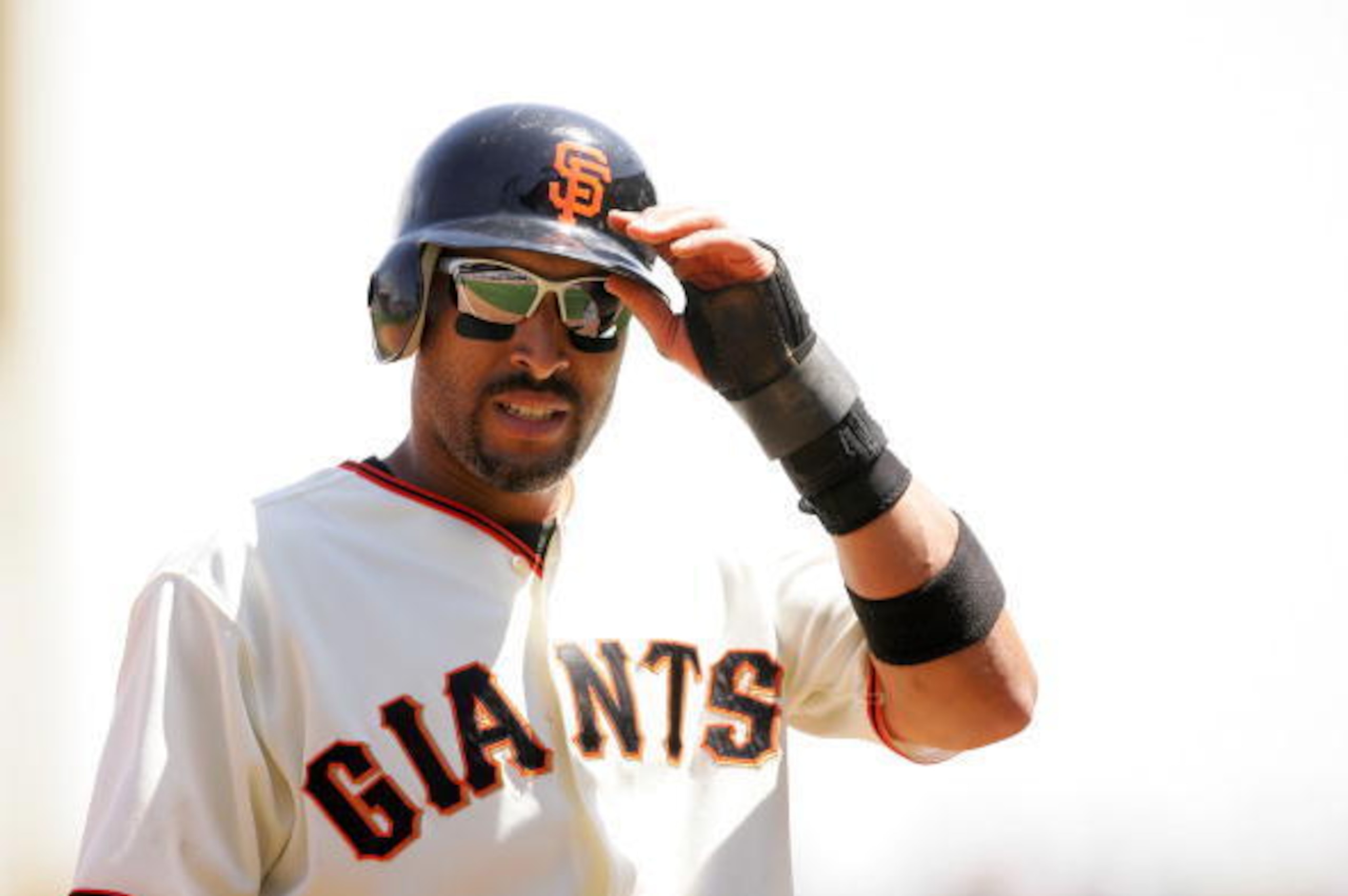 SAN FRANCISCO - MAY 13:  Randy Winn #2 of the San Francisco Giants stands up after reaching third base during their game against the Washington Nationals at AT&T Park on May 13, 2009 in San Francisco, California.  (Photo by Ezra Shaw/Getty Images)