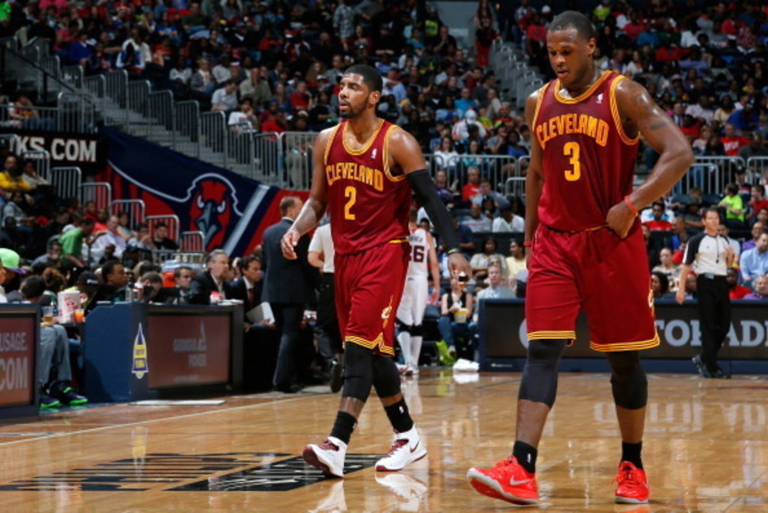 ATLANTA, GA - APRIL 04:  Kyrie Irving #2 and Dion Waiters #3 of the Cleveland Cavaliers walk off the court between free throws in their 117-98 loss to the Atlanta Hawks at Philips Arena on April 4, 2014 in Atlanta, Georgia.  NOTE TO USER: User expressly a