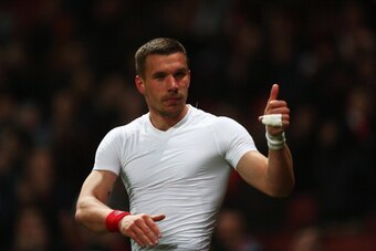 LONDON, ENGLAND - APRIL 15:  Lukas Podolski of Arsenal celebrates victory after the Barclays Premier League match between Arsenal and West Ham United at Emirates Stadium on April 15, 2014 in London, England.  (Photo by Paul Gilham/Getty Images)