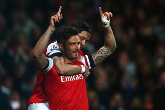 LONDON, ENGLAND - APRIL 15:  Olivier Giroud of Arsenal (R) celebrates with Tomas Rosicky as he scores their second goal during the Barclays Premier League match between Arsenal and West Ham United at Emirates Stadium on April 15, 2014 in London, England. 