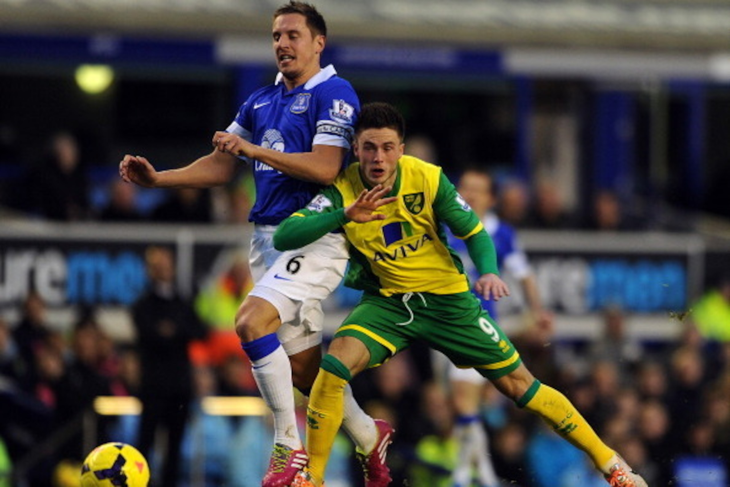 LIVERPOOL, ENGLAND - JANUARY 11: Phil Jagielka of Everton in action with Ricky Van Wolfswinkel of Norwich City during the Barclays Premier League match between Everton and Norwich City at Goodison Park on January 11, 2014 in Liverpool, England. (Photo by 
