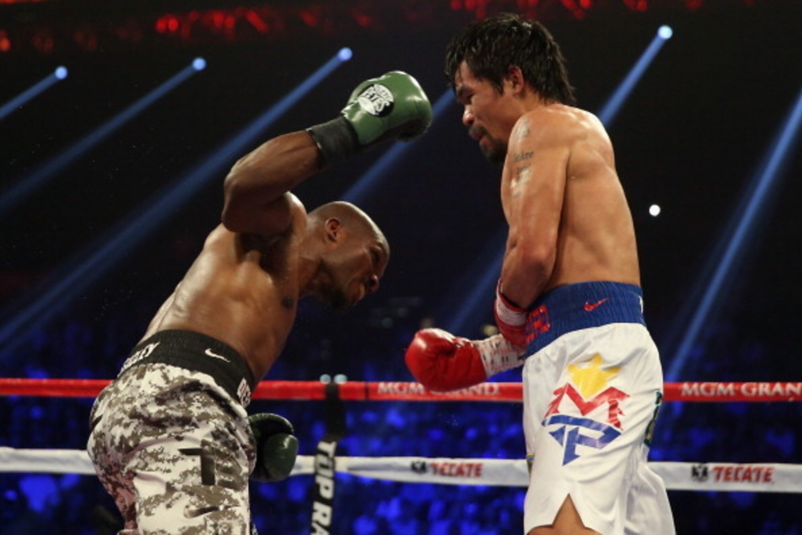 LAS VEGAS, NV - APRIL 12:  Timothy Bradley throws a right hand at Manny Pacquiao at the MGM Grand Garden Arena on April 12, 2014 in Las Vegas, Nevada.  (Photo by Jeff Gross/Getty Images)