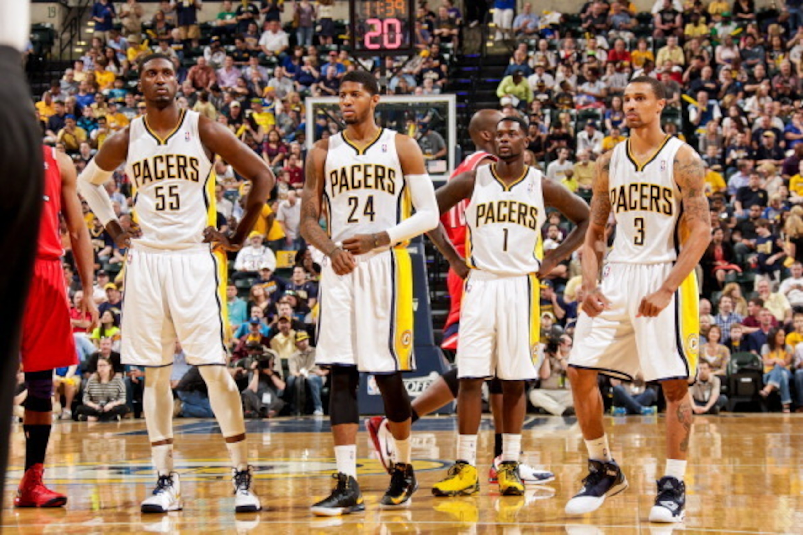 INDIANAPOLIS, IN - MAY 1: Indiana Pacers players Roy Hibbert #55, Paul George #24, Lance Stephenson #1 and George Hill #3 wait to resume play action against the Atlanta Hawks in Game Five of the Eastern Conference Quarterfinals during the 2013 NBA Playoff