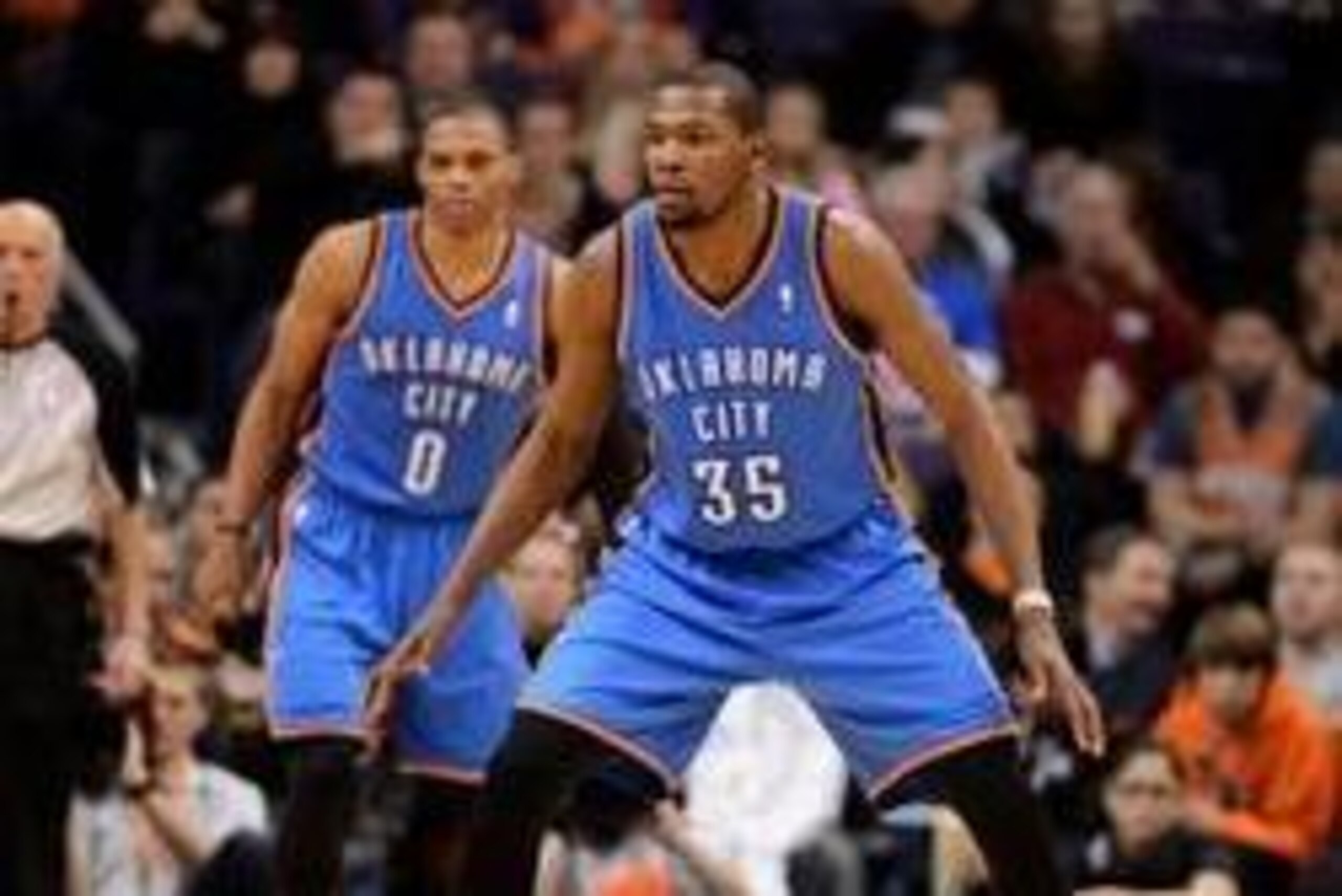Jan. 14, 2013; Phoenix, AZ, USA; Oklahoma City Thunder forward Kevin Durant (35) and guard Russell Westbrook (0) play defense in the game against the Phoenix Suns at the US Airways Center. The Thunder defeated the Suns 102-90. Mandatory Credit: Jennifer S