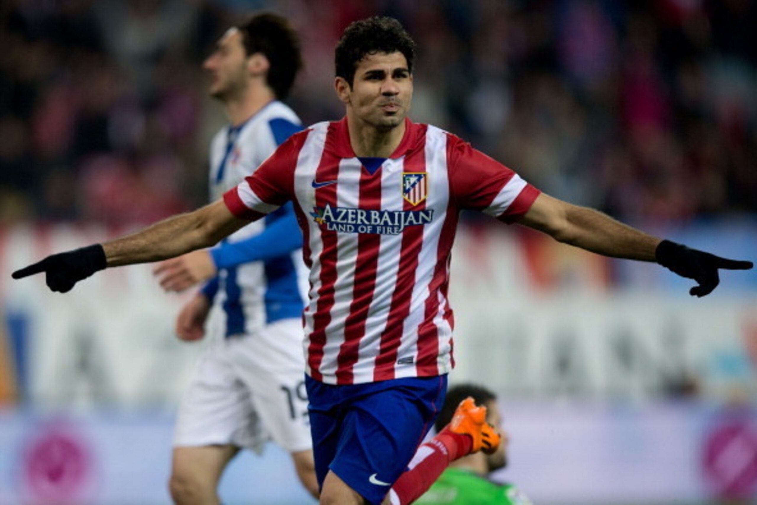 MADRID, SPAIN - MARCH 15:  Diego Costa of Atletico de Madrid celebrates scoring their opening goal during the La Liga match between Club Atletico de Madrid and RCD Espanyol at Vicente Calderon Stadium on March 15, 2014 in Madrid, Spain.  (Photo by Gonzalo