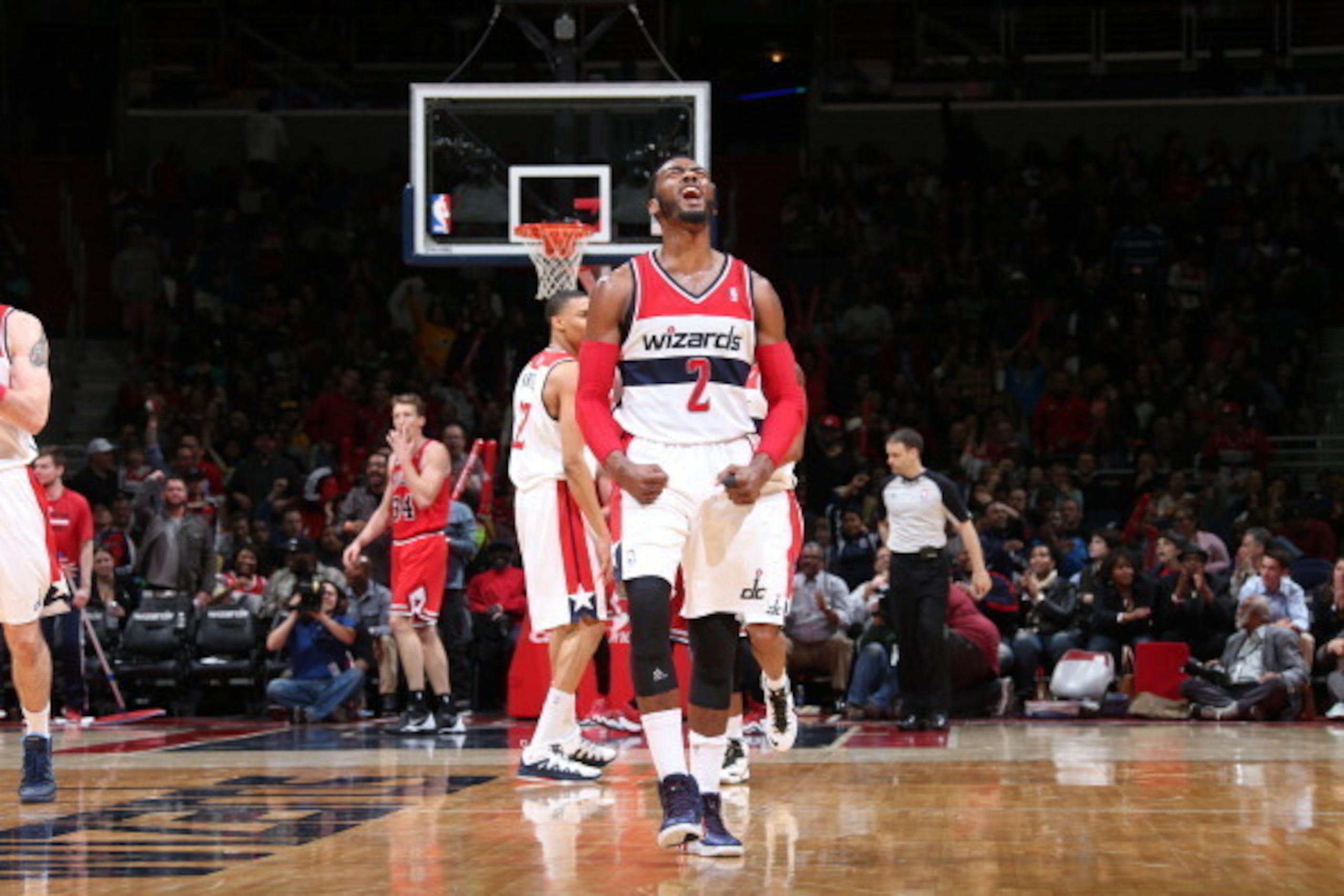WASHINGTON, DC - APRIL 5:  John Wall #2 of the Washington Wizards celebrates a made basket against the Chicago Bulls during the game at the Verizon Center on April 5, 2014 in Washington, DC. NOTE TO USER: User expressly acknowledges and agrees that, by do