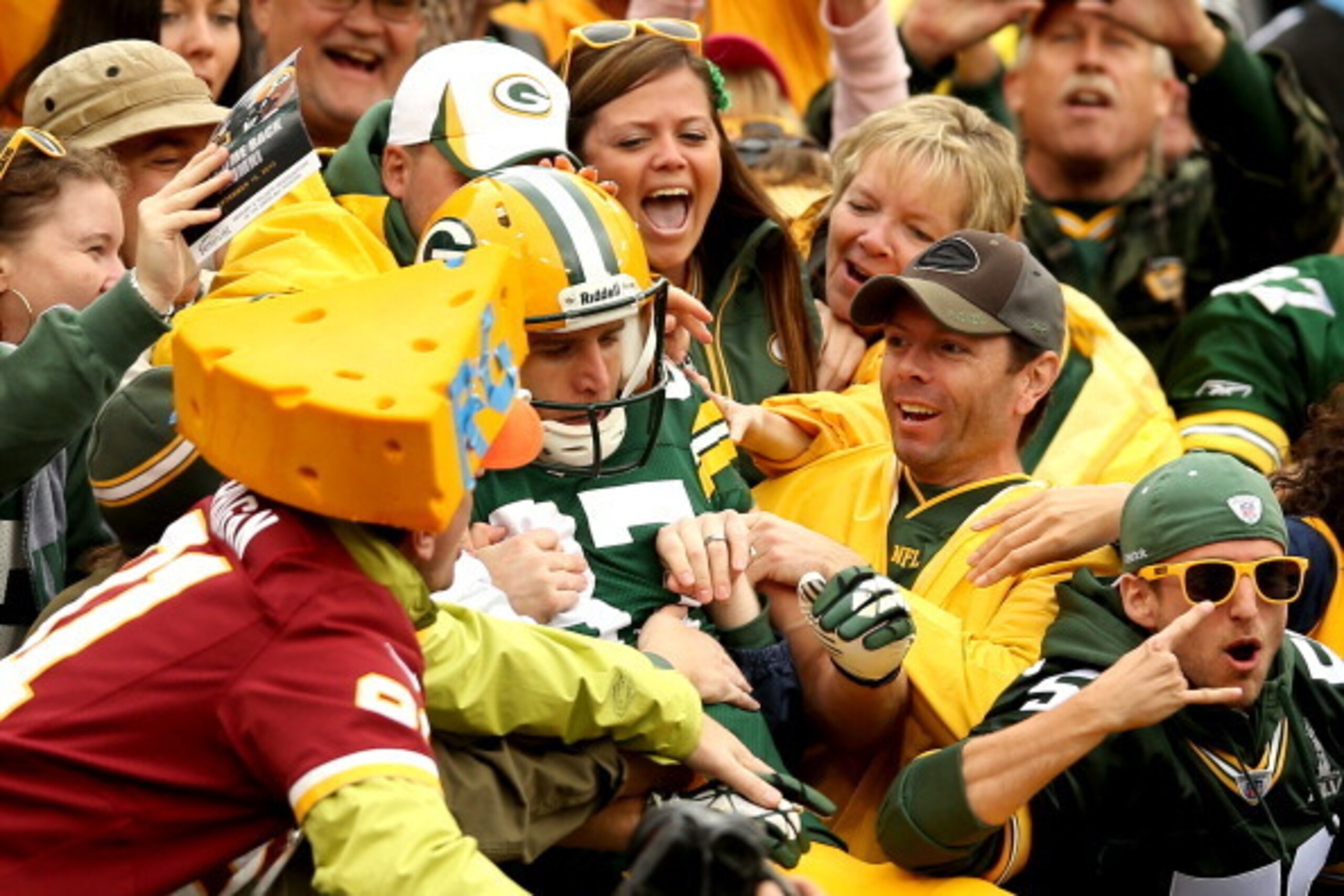 GREEN BAY, WI - SEPTEMBER 15:  Jordy Nelson #87 of the Green Bay Packers leaps into the stands after scoring a touchdown against the Washington Redskins at Lambeau Field on September 15, 2013 in Green Bay, Wisconsin.  (Photo by Matthew Stockman/Getty Imag