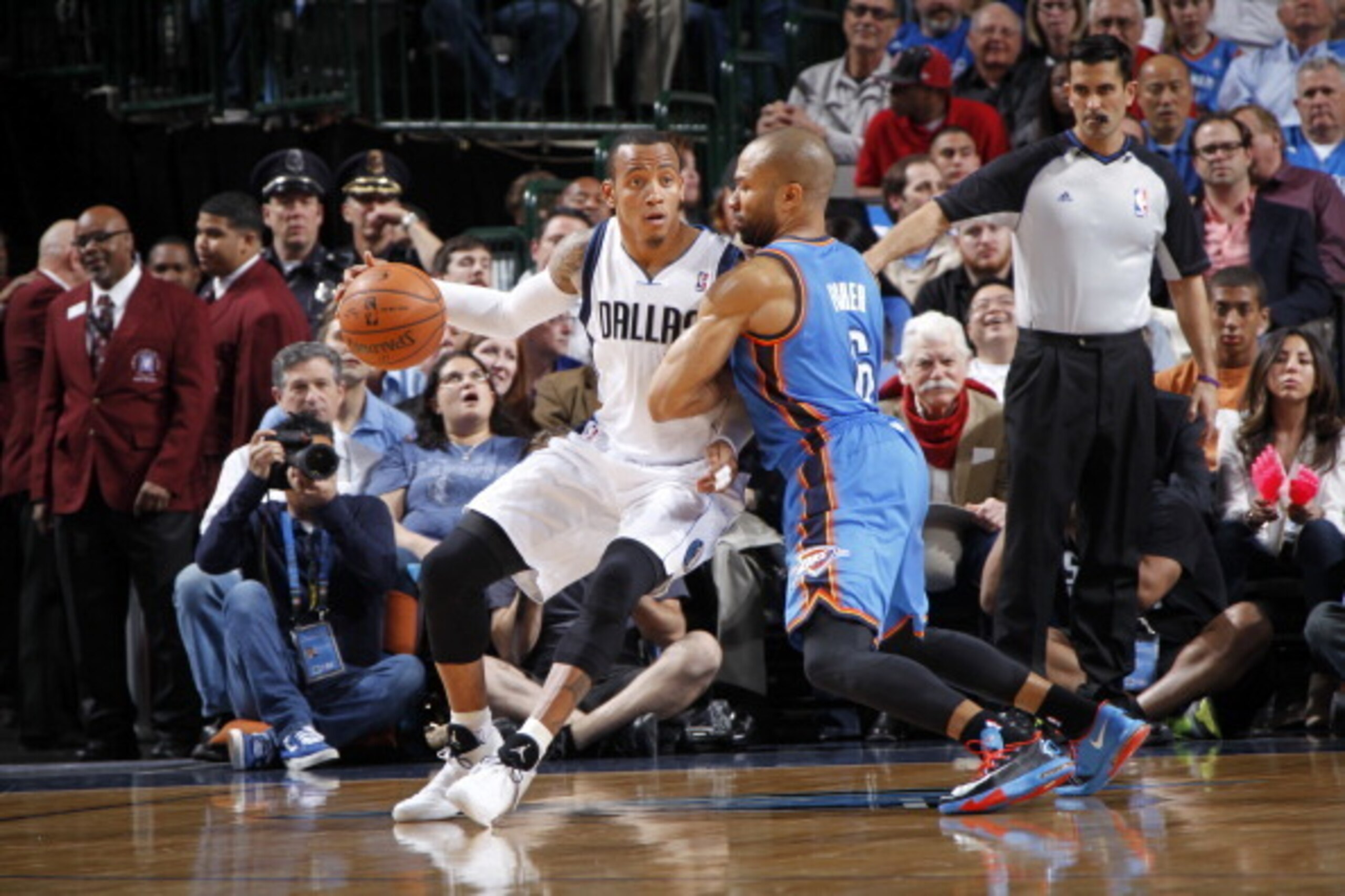 DALLAS, TX - MARCH 25: Monta Ellis #11 of the Dallas Mavericks controls the ball against Derek Fisher #6 of the Oklahoma City Thunder on March 25, 2014 at the American Airlines Center in Dallas, Texas. NOTE TO USER: User expressly acknowledges and agrees 