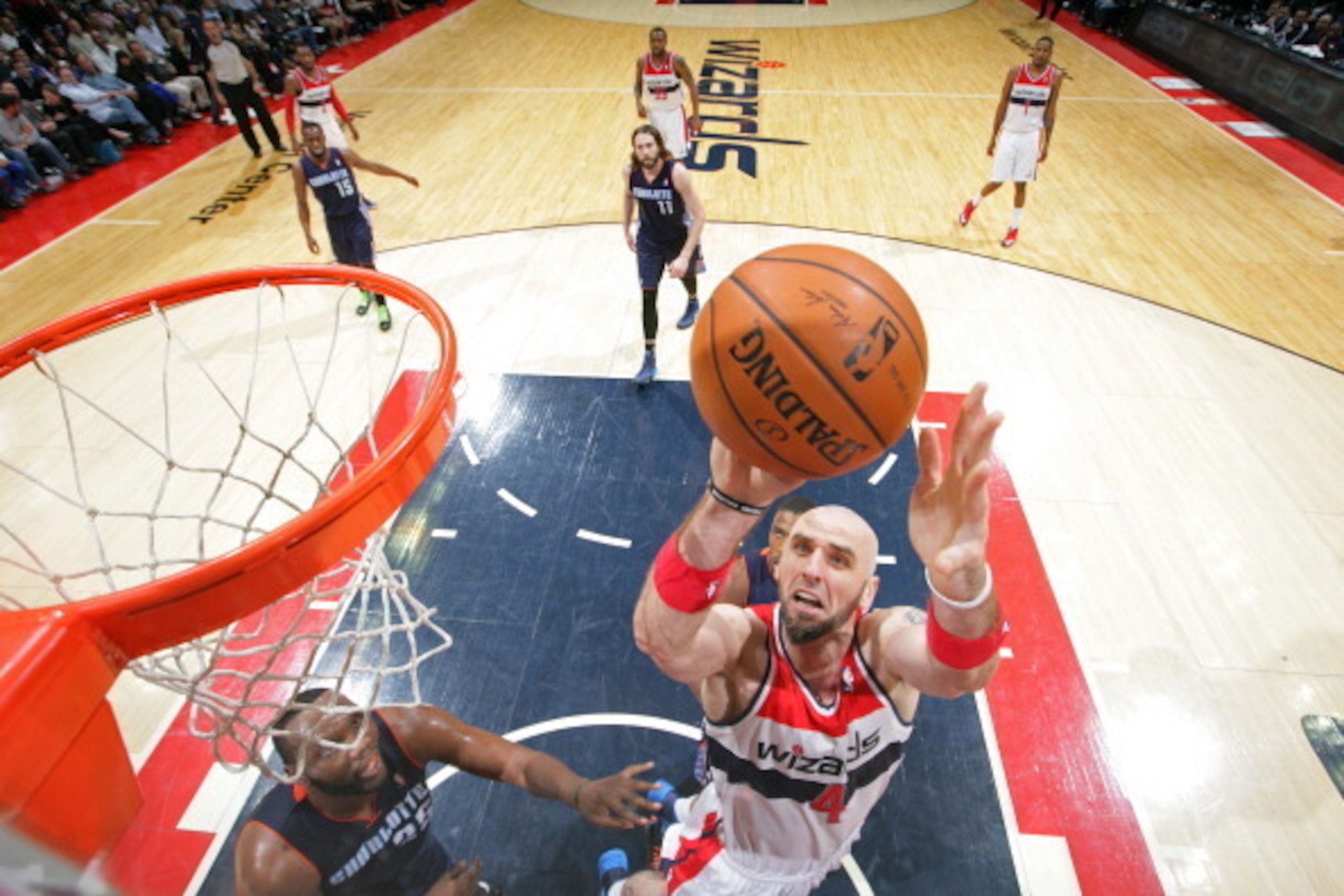 WASHINGTON, DC - APRIL 9: Marcin Gortat #4 of the Washington Wizards takes a shot against the Charlotte Bobcats  at the Verizon Center on April 9, 2014 in Washington, DC. NOTE TO USER: User expressly acknowledges and agrees that, by downloading and or usi