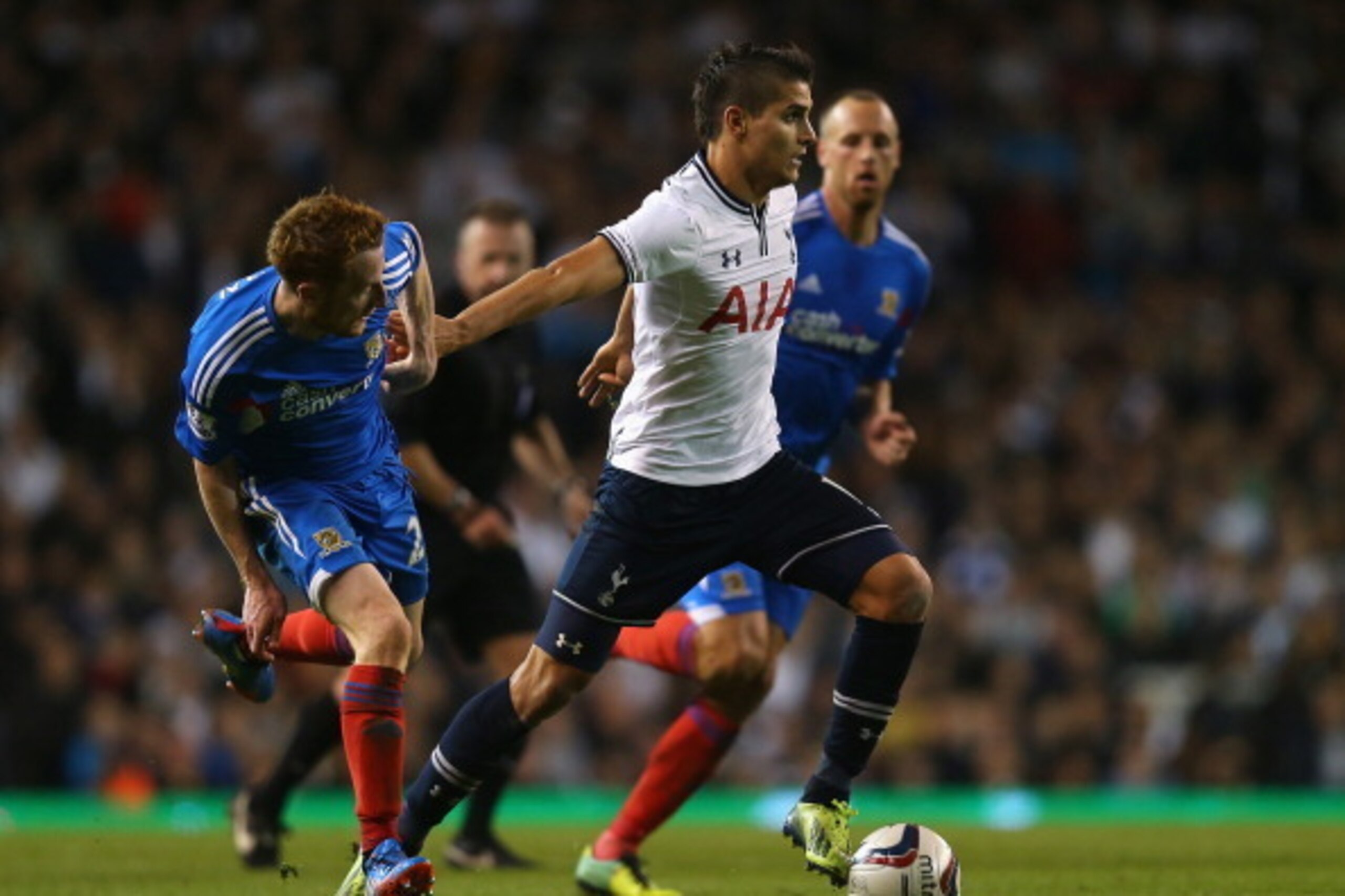 LONDON, ENGLAND - OCTOBER 30:  Erik Lamela of Tottenham brushes off the challenge of Stephen Quinn of Hull during the Capital One Cup Fourth Round match between Tottenham Hotspur and Hull City at White Hart Lane on October 30, 2013 in London, England.  (P