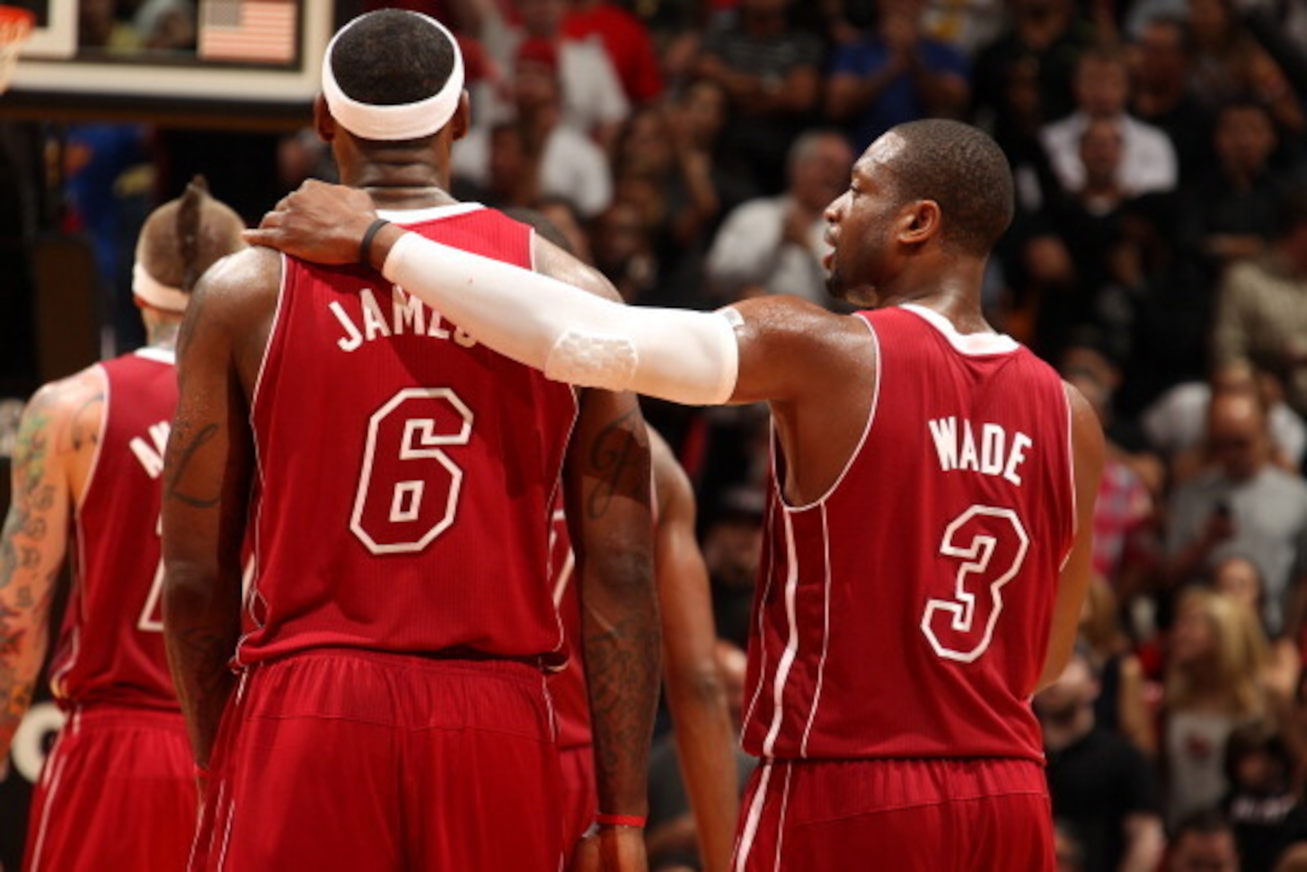 MIAMI, FL - DECEMBER 18: LeBron James #6 and Dwyane Wade #3 of the Miami Heat share a word with during the game against the Indiana Pacers on December 18, 2013 at American Airlines Arena in Miami, Florida. NOTE TO USER: User expressly acknowledges and agr