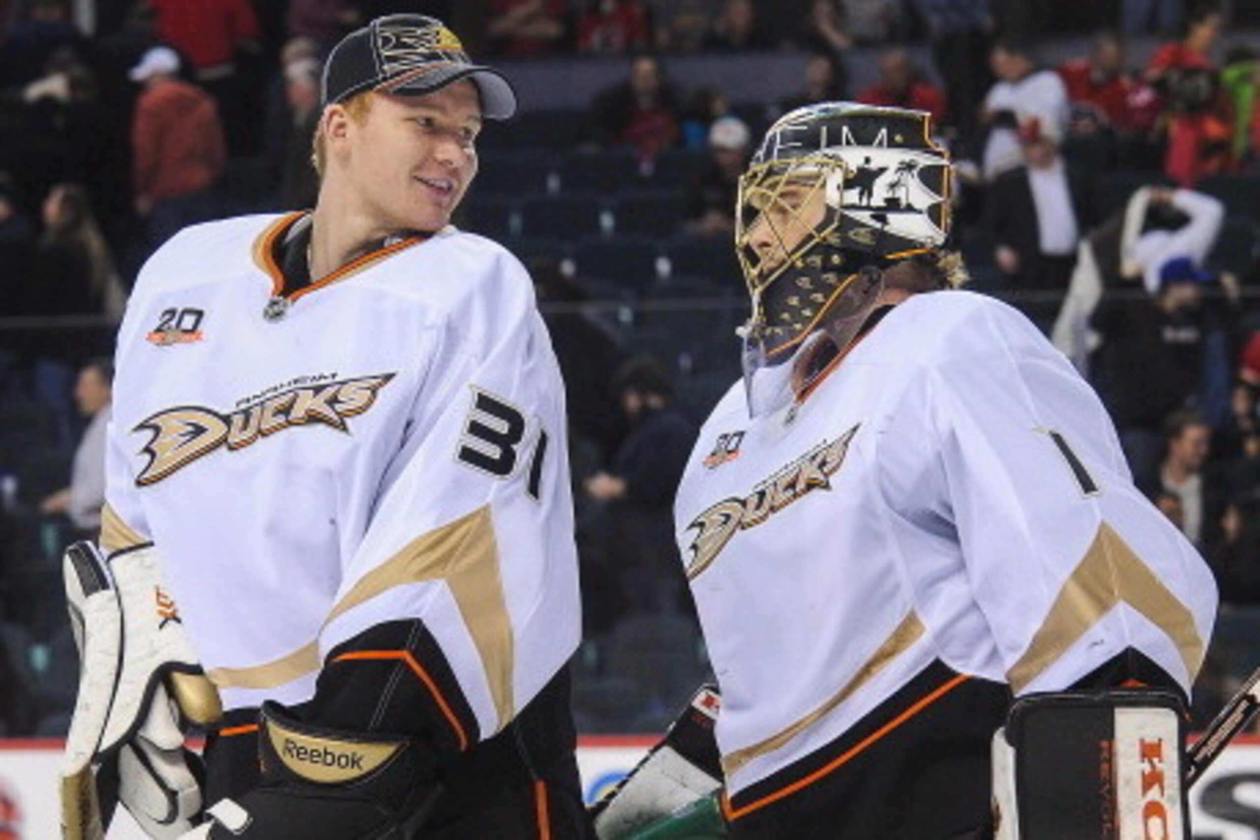 CALGARY, AB - MARCH 26: Frederik Andersen #31 (L) and Jonas Hiller #1 of the Anaheim Ducks celebrate after defeating the Calgary Flames during an NHL game at Scotiabank Saddledome on March 26, 2014 in Calgary, Alberta, Canada. The Ducks defeated the Flame