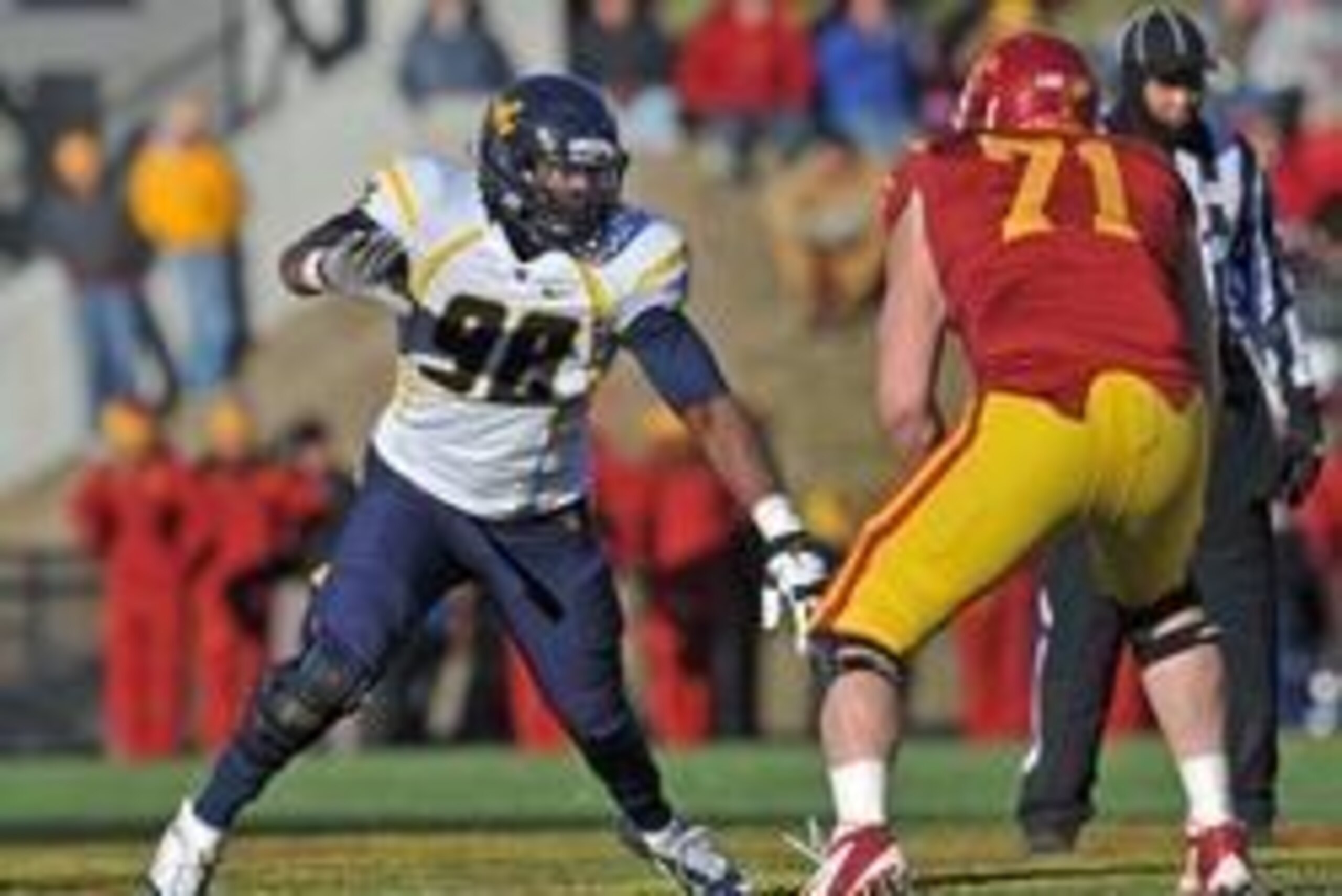 Nov 23, 2012; Ames, Iowa, USA; West Virginia Mountaineers defensive end Will Clarke (98) gets set on defense against the Iowa State Cyclones during the first half at Jack Trice Stadium.  Mandatory Credit: Peter G. Aiken-USA TODAY Sports