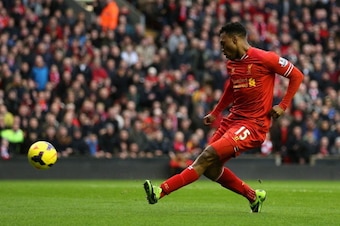 LIVERPOOL, ENGLAND - FEBRUARY 23:  Daniel Sturridge of Liverpool scores the first goal during the Barclays Premier League match between Liverpool and Swansea City at Anfield on February 23, 2014 in Liverpool, England.  (Photo by Clive Brunskill/Getty Imag