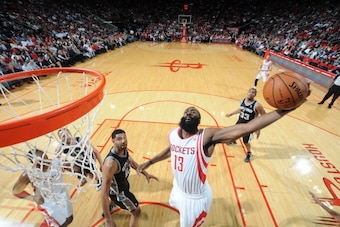 HOUSTON, TX - APRIL 14:  James Harden #13 of the Houston Rockets goes up for a dunk against the San Antonio Spurs on April 14, 2014 at the Toyota Center in Houston, Texas. NOTE TO USER: User expressly acknowledges and agrees that, by downloading and or us